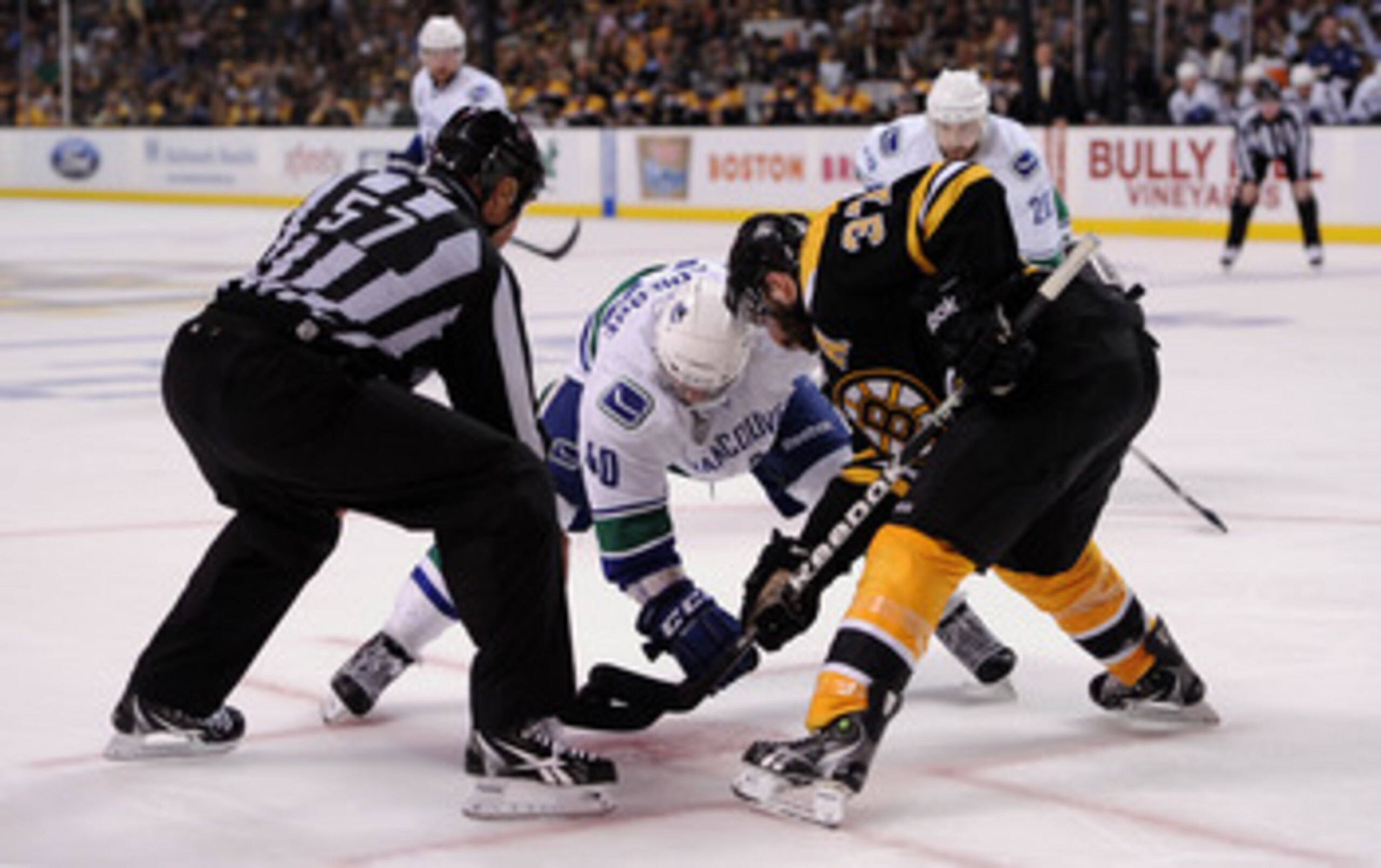 BOSTON, MA - JUNE 08:  Maxim Lapierre #40 of the Vancouver Canucks faces off agianst Patrice Bergeron #37 of the Boston Bruins during Game Four of the 2011 NHL Stanley Cup Final at TD Garden on June 8, 2011 in Boston, Massachusetts.  (Photo by Harry How/G