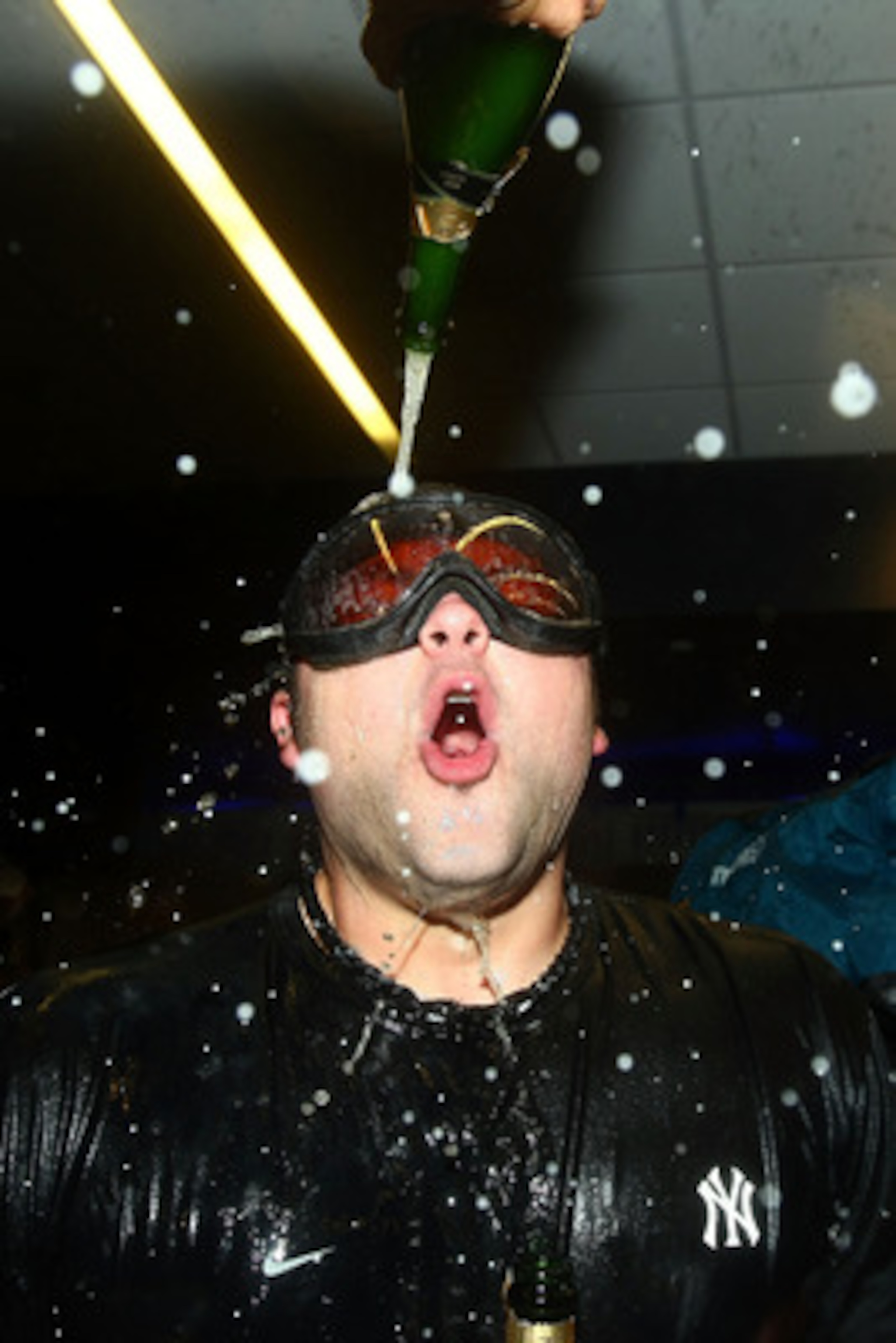 NEW YORK - OCTOBER 09:  Joba Chamberlain #62 of the New York Yankees celebrates in the locker room against the Minnesota Twins during Game Three of the ALDS part of the 2010 MLB Playoffs at Yankee Stadium on October 9, 2010 in the Bronx borough of New Yor