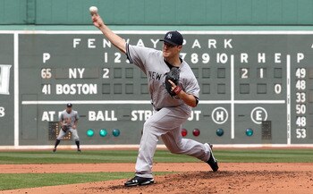 BOSTON, MA - APRIL 8:  Phil Hughes #65 of New York Yankees throws against the Boston Red Sox in the first inning on Opening Day at Fenway Park on April 8, 2011 in Boston, Massachusetts. (Photo by Jim Rogash/Getty Images)