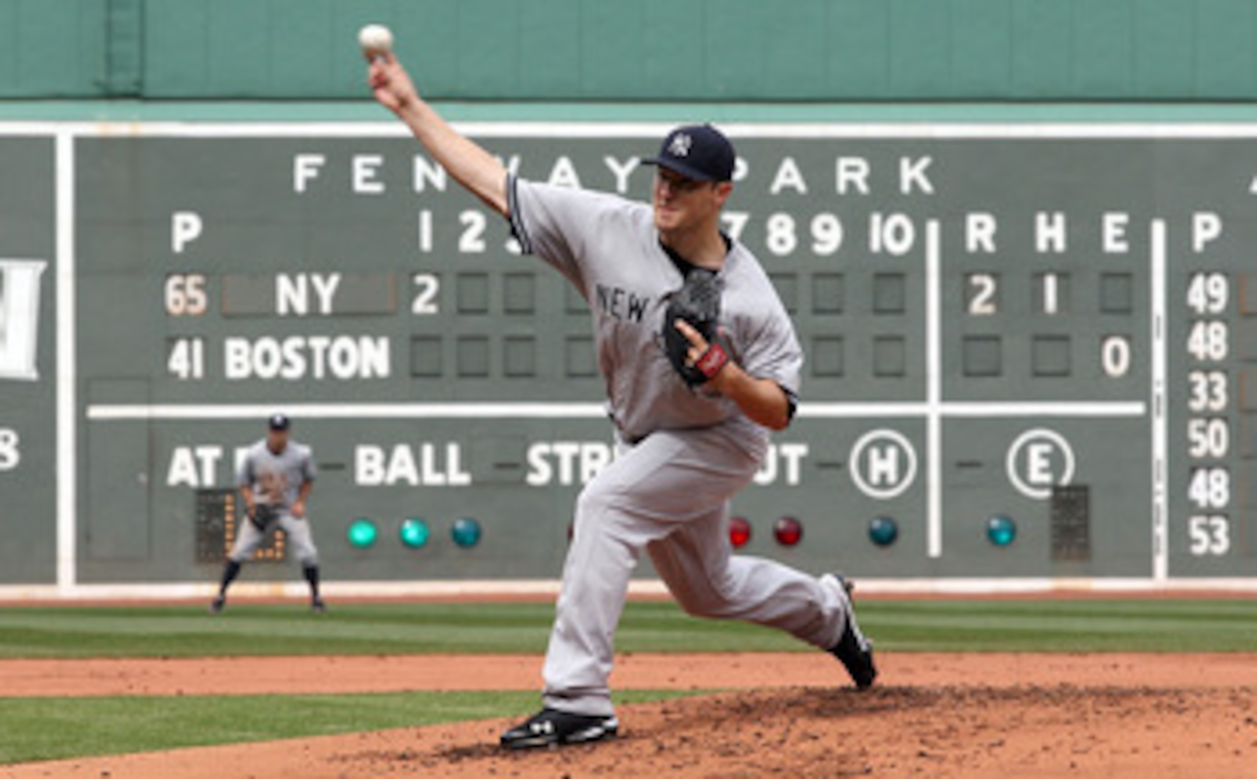 BOSTON, MA - APRIL 8:  Phil Hughes #65 of New York Yankees throws against the Boston Red Sox in the first inning on Opening Day at Fenway Park on April 8, 2011 in Boston, Massachusetts. (Photo by Jim Rogash/Getty Images)