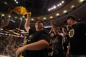 BOSTON, MA - JUNE 08:  Boston Bruins fans cheer during Game Four against the Vancouver Canucks in the 2011 NHL Stanley Cup Final at TD Garden on June 8, 2011 in Boston, Massachusetts.  (Photo by Elsa/Getty Images)