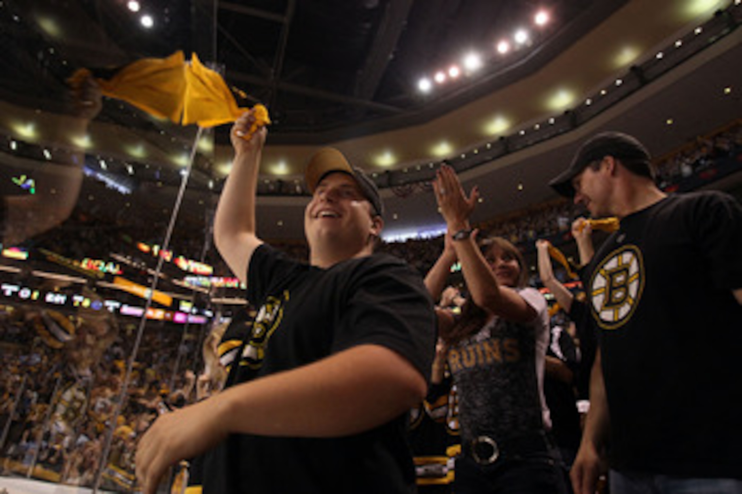 BOSTON, MA - JUNE 08:  Boston Bruins fans cheer during Game Four against the Vancouver Canucks in the 2011 NHL Stanley Cup Final at TD Garden on June 8, 2011 in Boston, Massachusetts.  (Photo by Elsa/Getty Images)