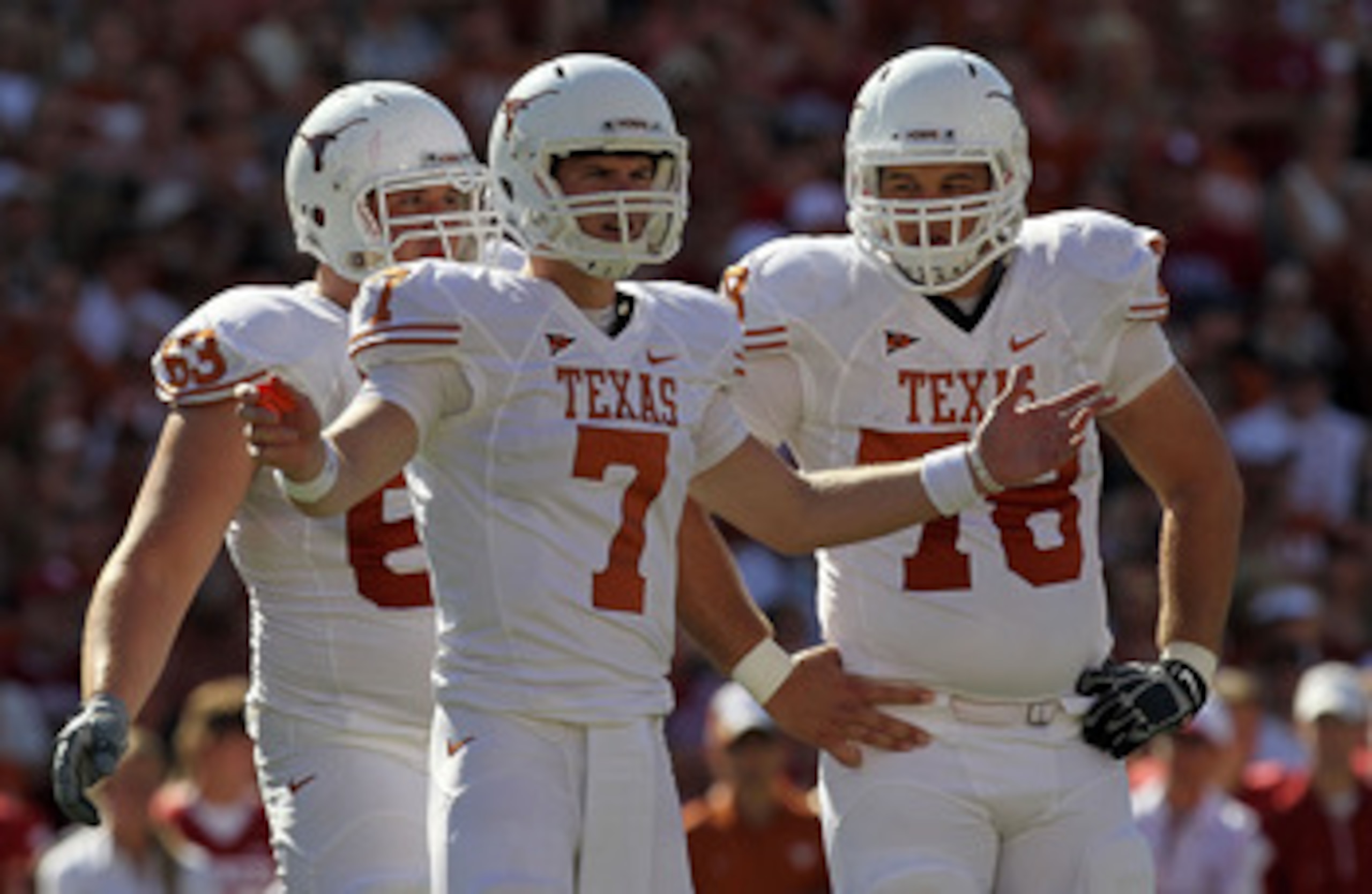 DALLAS - OCTOBER 02: Quarterback Garrett Gilbert #7 of the Texas Longhorns reacts during play against the Oklahoma Sooners at the Cotton Bowl on October 2, 2010 in Dallas, Texas. (Photo by Ronald Martinez/Getty Images) DALLAS - OCTOBER 02: Quarterback Garrett Gilbert #7 of the Texas Longhorns reacts during play against the Oklahoma Sooners at the Cotton Bowl on October 2, 2010 in Dallas, Texas. (Photo by Ronald Martinez/Getty Images)