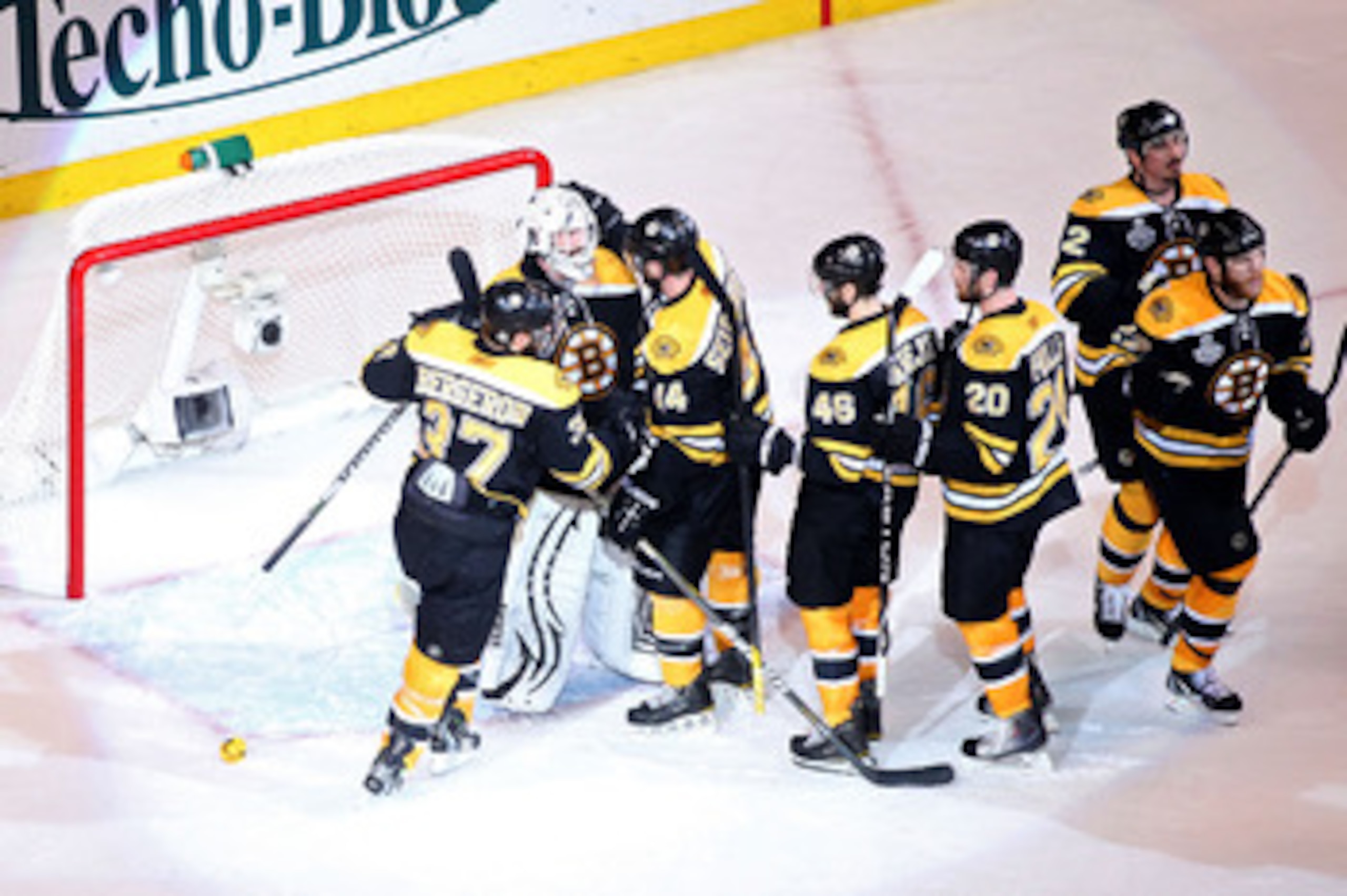 BOSTON, MA - JUNE 08:  Tim Thomas #30 of the Boston Bruins celebrates with his teammates Patrice Bergeron #37, Dennis Seidenberg #44, David Krejci #46 and Daniel Paille #20 after defeating the Vancouver Canucks in Game Four of the 2011 NHL Stanley Cup Fin