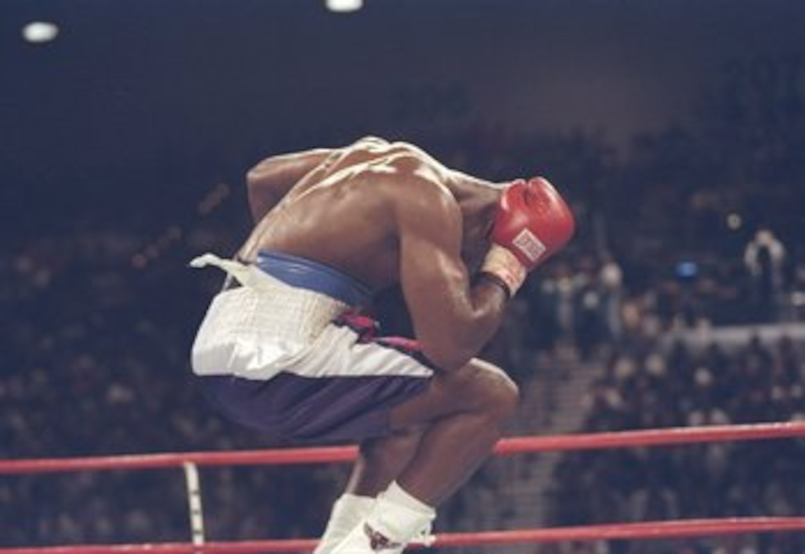 28 Jun 1997: Evander Holyfield jumps in the air and holds his head in agony after Mike Tyson bit a piece off his right ear in the third round of their heavyweight title fight at the MGM Grand Garden in Las Vegas, Nevada. Holyfield won the fight when refer