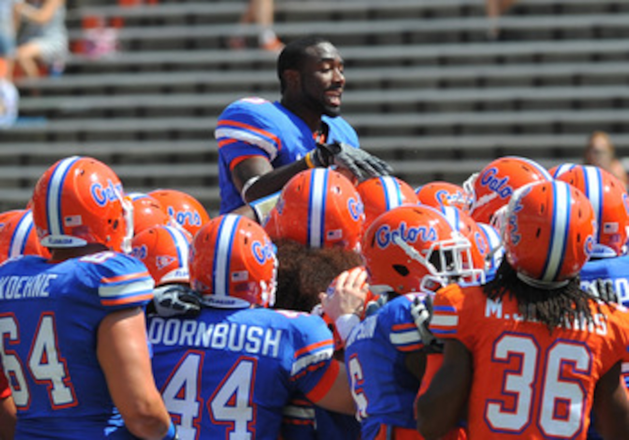 GAINESVILLE, FL - APRIL 9: Running back Chris Rainey #3 of the Florida Gators climbs to the top of a team huddle before the Orange and Blue spring football game April 9, 2011 at Ben Hill Griffin Stadium in Gainesville, Florida. (Photo by Al Messerschmid GAINESVILLE, FL - APRIL 9: Running back Chris Rainey #3 of the Florida Gators climbs to the top of a team huddle before the Orange and Blue spring football game April 9, 2011 at Ben Hill Griffin Stadium in Gainesville, Florida. (Photo by Al Messerschmid