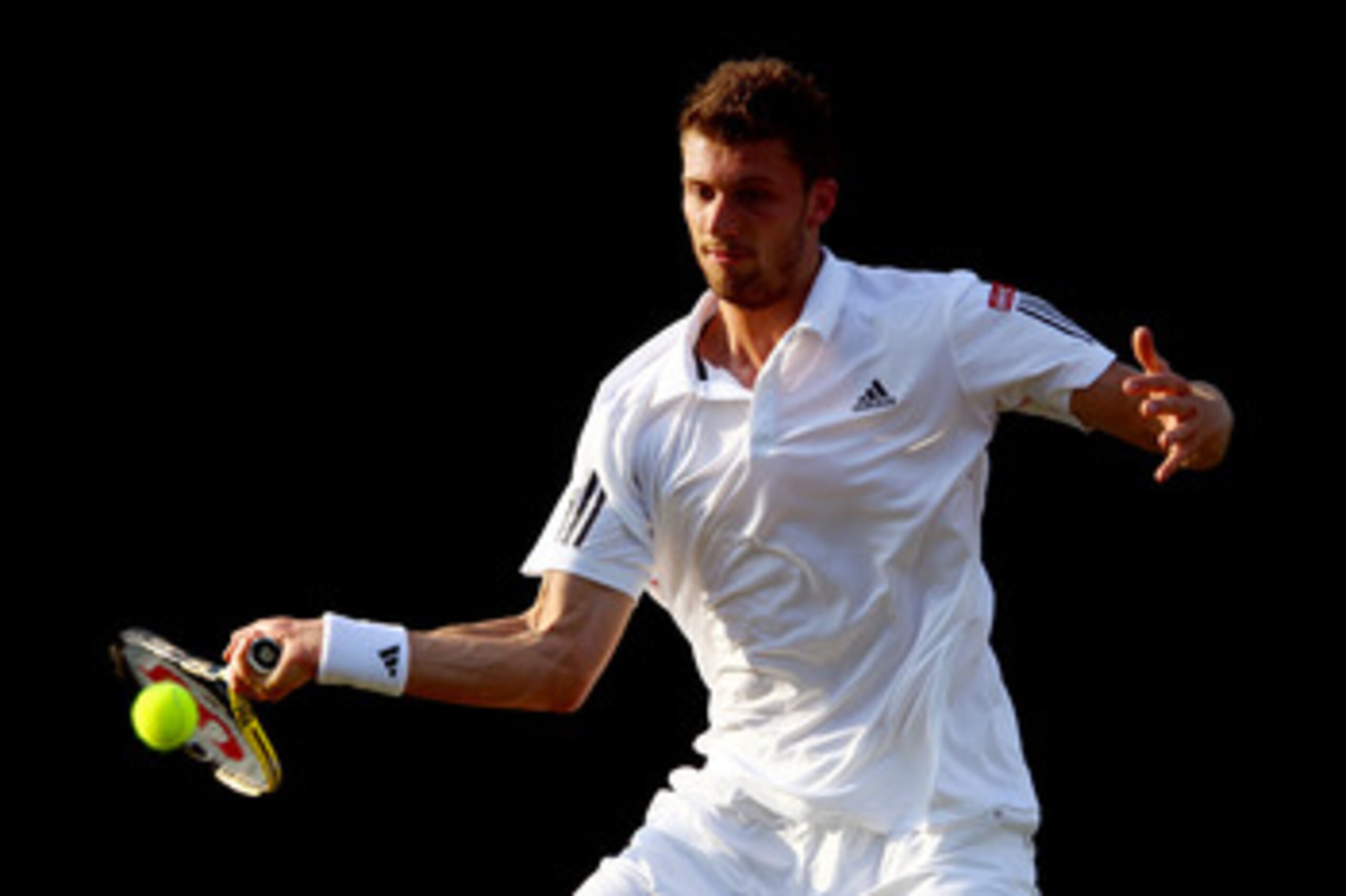 LONDON, ENGLAND - JUNE 23:  Daniel Brands of Germany in action during his second round match against Nikolay Davydenko of Russia on Day Three of the Wimbledon Lawn Tennis Championships at the All England Lawn Tennis and Croquet Club on June 23, 2010 in Lo