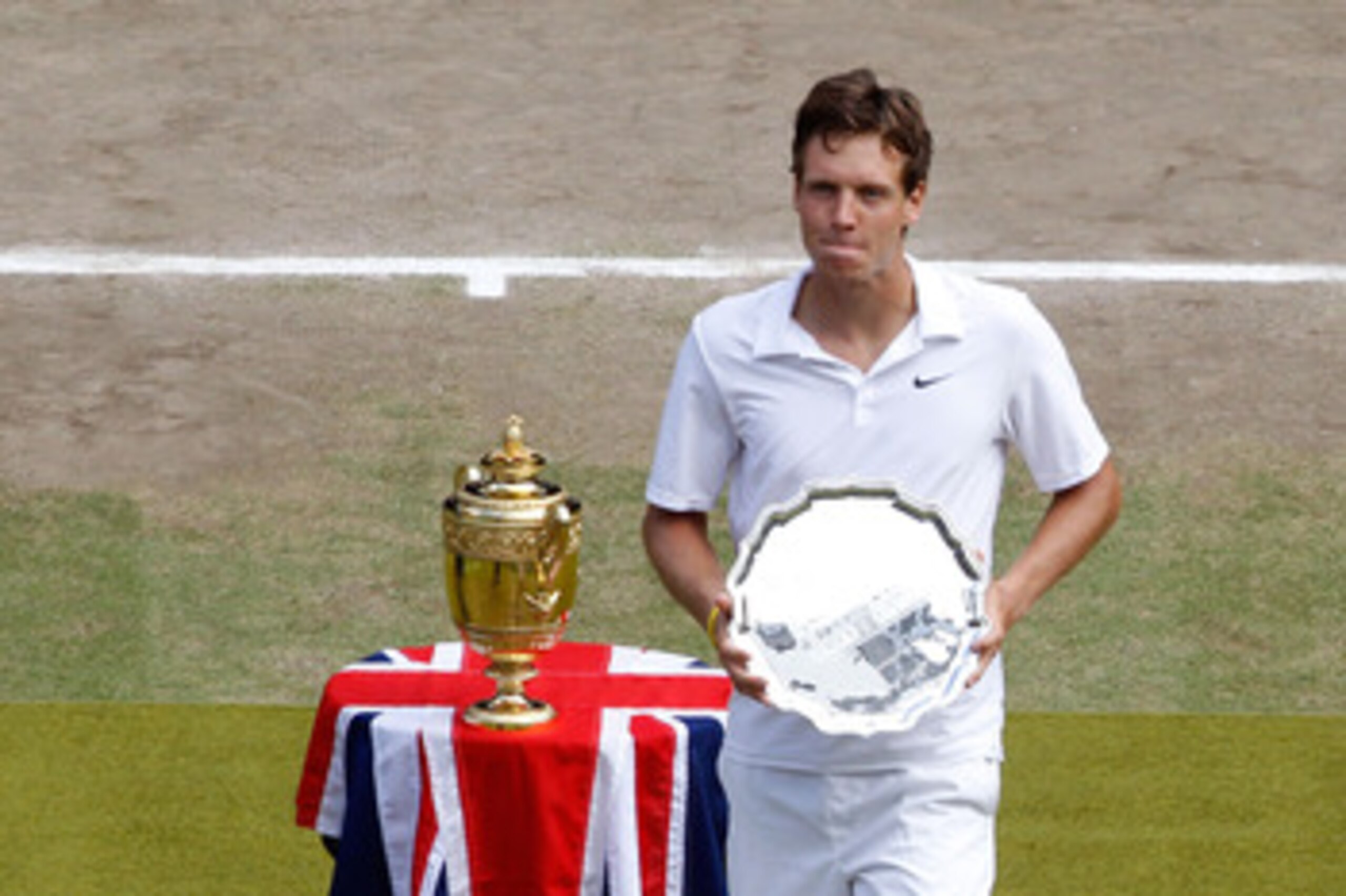 LONDON, ENGLAND - JULY 04:  Tomas Berdych of Czech Republic is presented with the Runners up trophy after the Mens Singles Final match against Rafael Nadal of Spain on Day Thirteen of the Wimbledon Lawn Tennis Championships at the All England Lawn Tennis