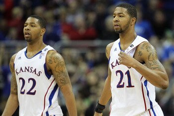 KANSAS CITY, MO - MARCH 11:  Marcus Morris #22 and Markieff Morris #21 of the Kansas Jayhawks walk on the court during their semifinal game against the Colorado Buffaloes in the 2011 Phillips 66 Big 12 Men's Basketball Tournament at Sprint Center on March