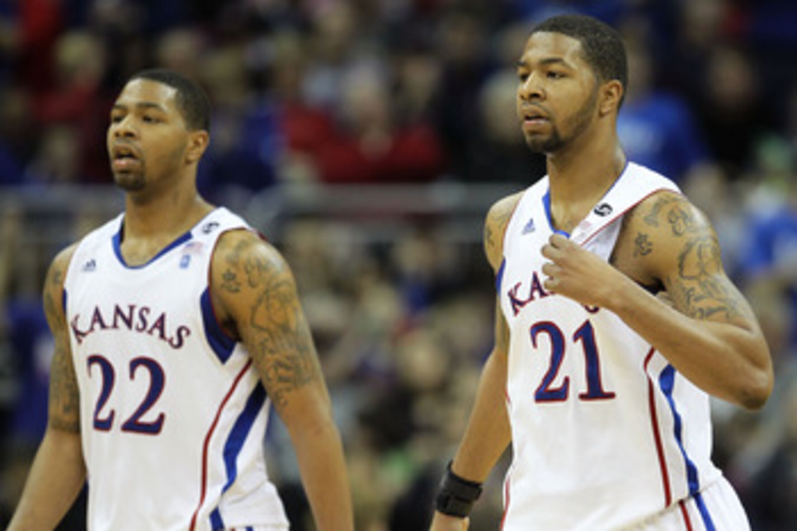 KANSAS CITY, MO - MARCH 11:  Marcus Morris #22 and Markieff Morris #21 of the Kansas Jayhawks walk on the court during their semifinal game against the Colorado Buffaloes in the 2011 Phillips 66 Big 12 Men's Basketball Tournament at Sprint Center on March