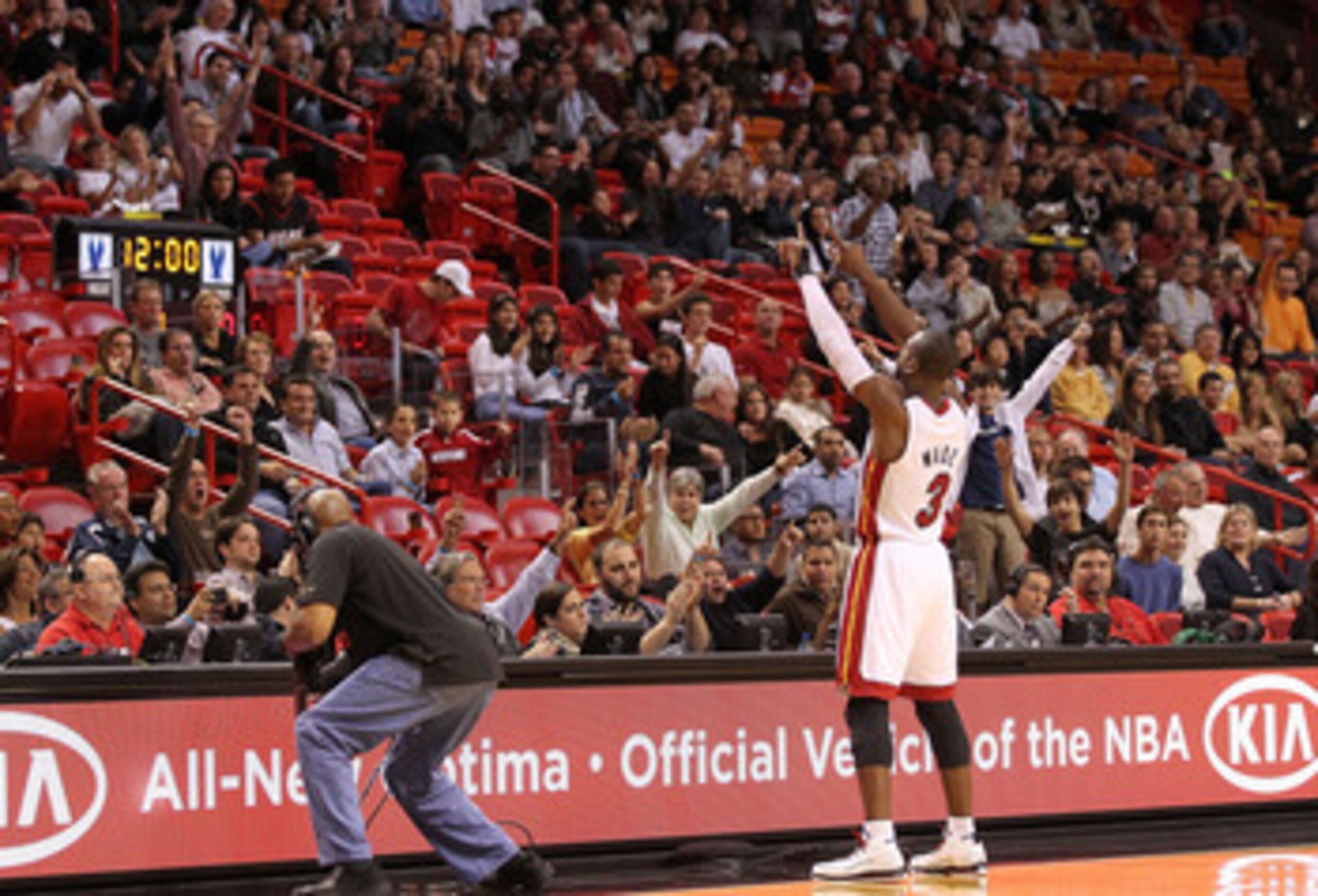 MIAMI, FL - DECEMBER 04:  Dwyane Wade #3 of the Miami Heat greets the crowd during a game against the Atlanta Hawks at American Airlines Arena on December 4, 2010 in Miami, Florida. NOTE TO USER: User expressly acknowledges and agrees that, by downloading
