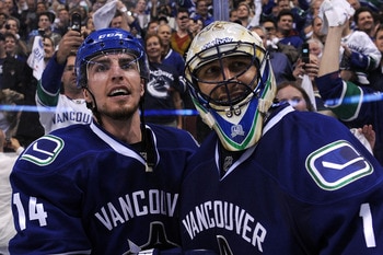 VANCOUVER, BC - MAY 24:  Alex Burrows #14 and goaltender Roberto Luongo #1 of the Vancouver Canucks celebrate after defeating the San Jose Sharks 3-2 in double-overtime in Game Five to win the Western Conference Finals 4-1 during the 2011 Stanley Cup Play