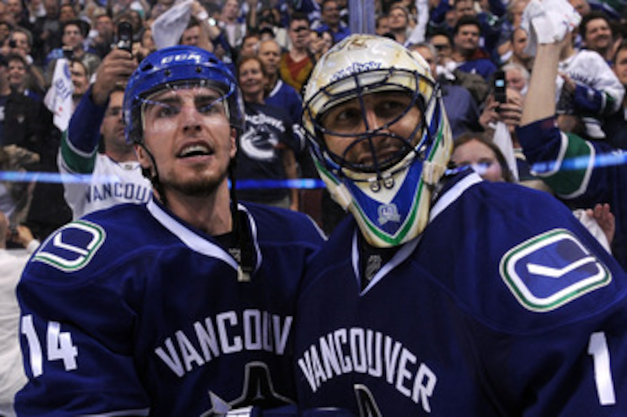VANCOUVER, BC - MAY 24:  Alex Burrows #14 and goaltender Roberto Luongo #1 of the Vancouver Canucks celebrate after defeating the San Jose Sharks 3-2 in double-overtime in Game Five to win the Western Conference Finals 4-1 during the 2011 Stanley Cup Play