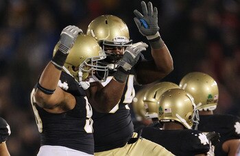 SOUTH BEND, IN - NOVEMBER 13: (L-R) Kona Schwenke #96 and Hafis Williams #94 of the Notre Dame Fighting Irish celebrate a win over the Utah Utes at Notre Dame Stadium on November 13, 2010 in South Bend, Indiana. Notre Dame defeated Utah 28-3. (Photo by Jo SOUTH BEND, IN - NOVEMBER 13: (L-R) Kona Schwenke #96 and Hafis Williams #94 of the Notre Dame Fighting Irish celebrate a win over the Utah Utes at Notre Dame Stadium on November 13, 2010 in South Bend, Indiana. Notre Dame defeated Utah 28-3. (Photo by Jo