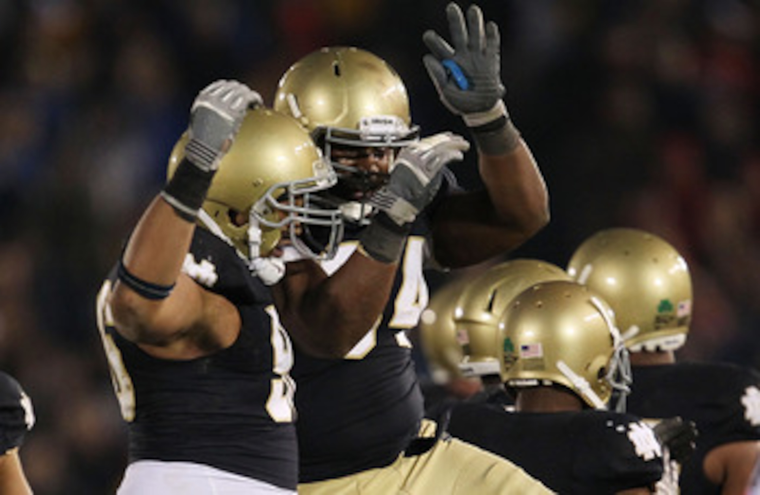 SOUTH BEND, IN - NOVEMBER 13: (L-R) Kona Schwenke #96 and Hafis Williams #94 of the Notre Dame Fighting Irish celebrate a win over the Utah Utes at Notre Dame Stadium on November 13, 2010 in South Bend, Indiana. Notre Dame defeated Utah 28-3. (Photo by Jo