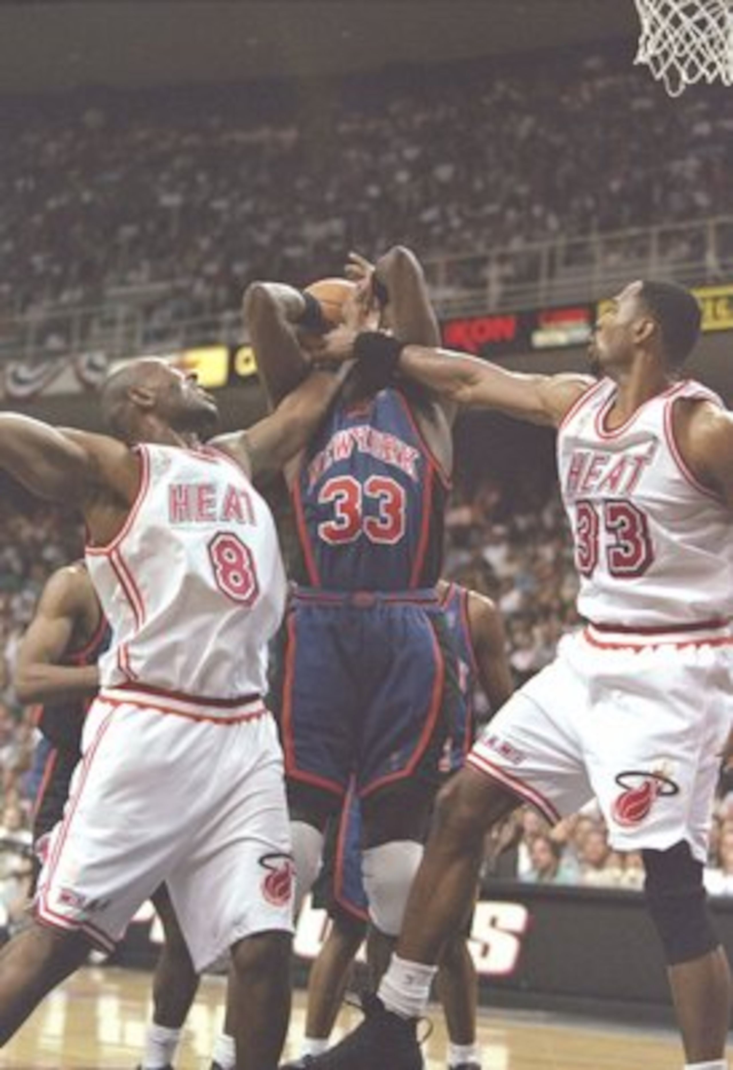 18 May 1997:  Center Patrick Ewing of the New York Knicks fight for the ball with center Alonzo Mourning and guard Isaac Austin of the Miami Heat during a playoff game at the Miami Arena in Miami, Florida.  The Heat won the game 101-90. Mandatory Credit: