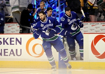 VANCOUVER, BC - JUNE 04:  Ryan Kesler #17 and Kevin Bieksa #3 of the Vancouver Canucks take to the ice prior to playing against the Boston Bruins in Game Two of the 2011 NHL Stanley Cup Final at Rogers Arena on June 4, 2011 in Vancouver, British Columbia,