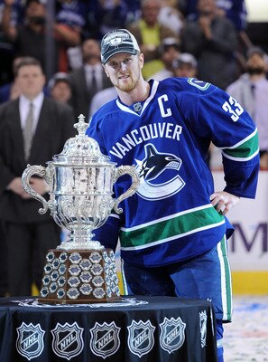 VANCOUVER, CANADA - MAY 24:  Captain Henrik Sedin #33 of the Vancouver Canucks poses with the Clarence Campbell Trophy after the Vancouver Canucks defeated the San Jose Sharks 3-2 in double-overtime in Game Five to win the Western Conference Finals during