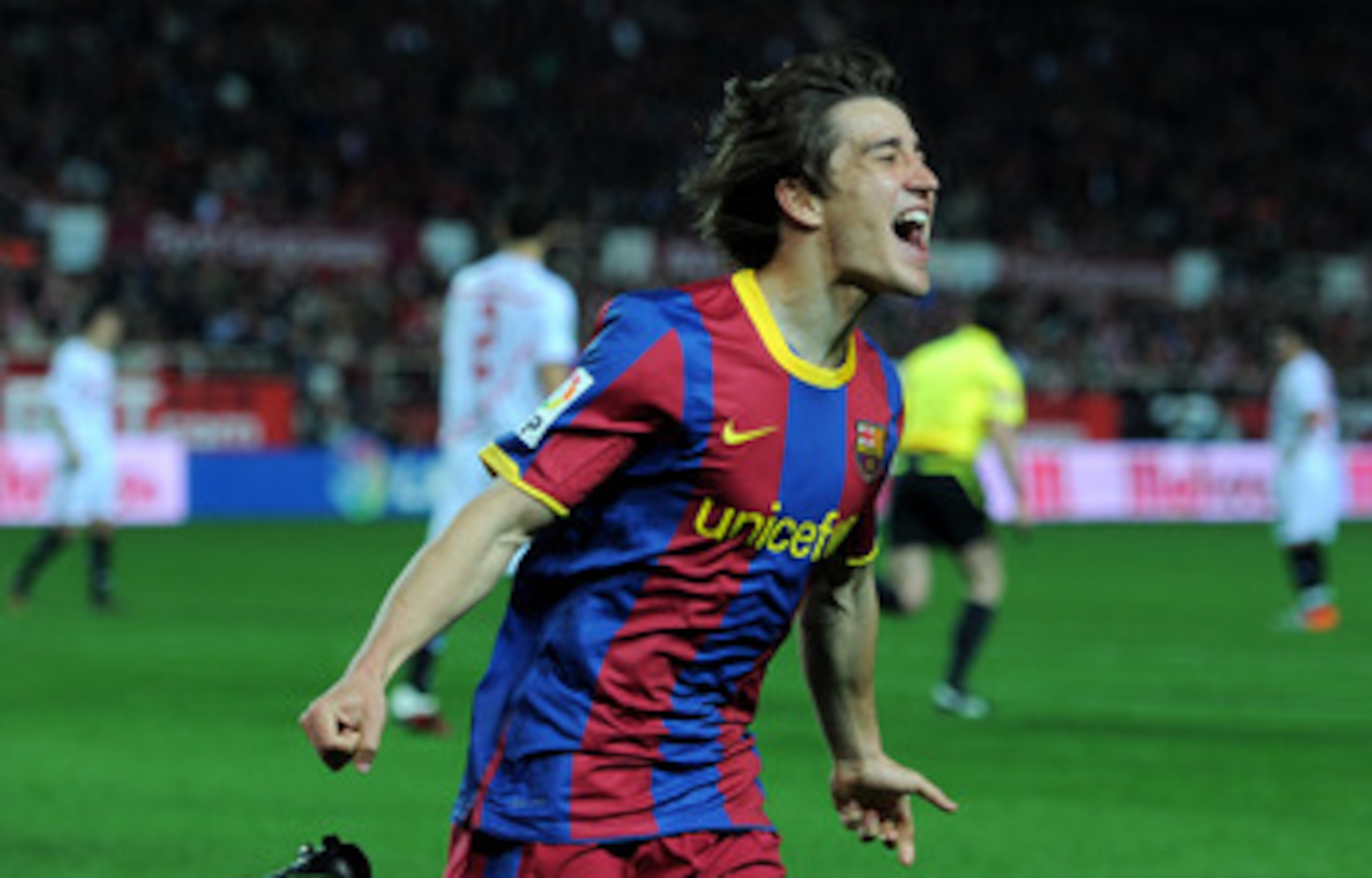SEVILLE, SPAIN - MARCH 13:  Bojan Krkic of Barcelona celebrates scoring his sides opening goal during the la Liga match between Sevilla and Barcelona at Estadio Ramon Sanchez Pizjuan on March 13, 2011 in Seville, Spain.  (Photo by Jasper Juinen/Getty Imag