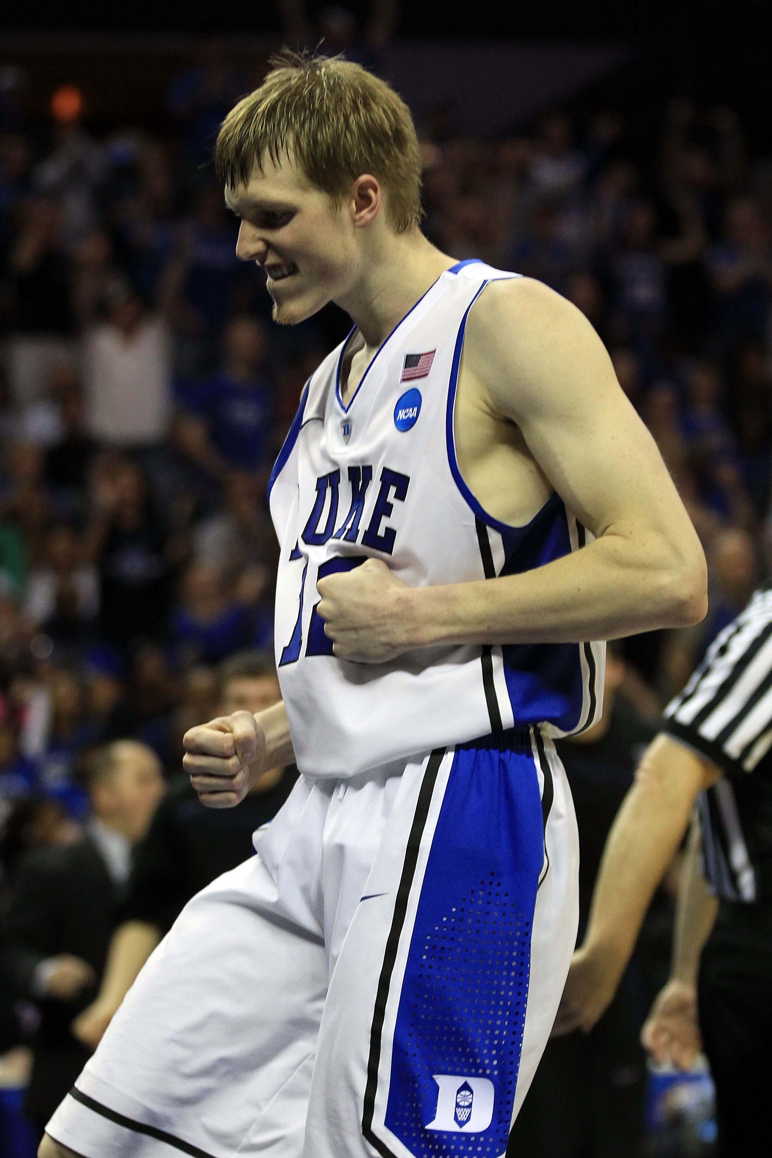 CHARLOTTE, NC - MARCH 20:  Kyle Singler #12 of the Duke Blue Devils reacts while taking on the Michigan Wolverines in the second half during the third round of the 2011 NCAA men's basketball tournament at Time Warner Cable Arena on March 20, 2011 in Charl