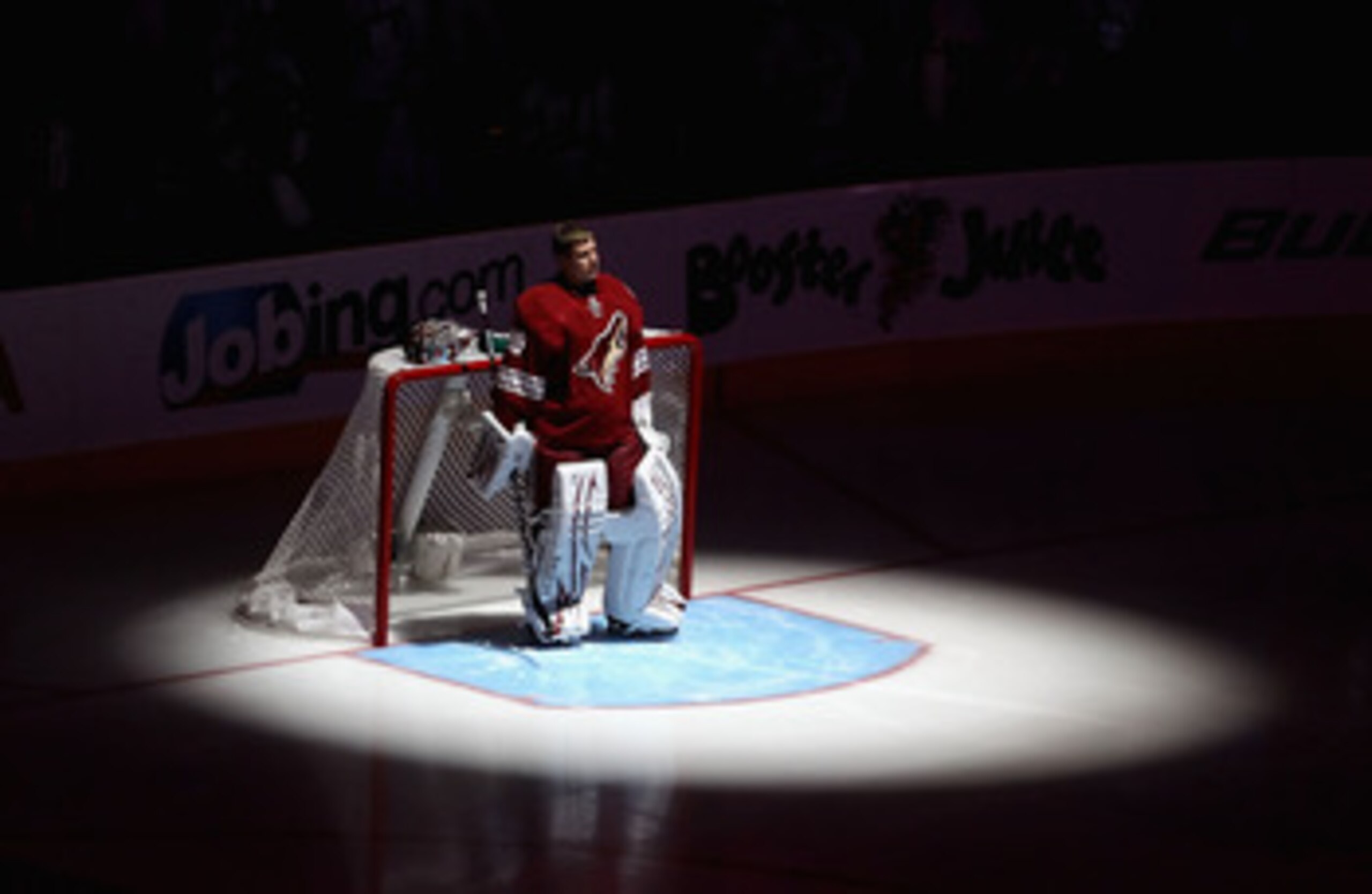 GLENDALE, AZ - APRIL 20: Goaltender Ilya Bryzgalov #30 of the Phoenix Coyotes stands attended for the National Anthem before Game Four of the Western Conference Quarterfinals against the Detroit Red Wings during the 2011 NHL Stanley Cup Playoffs at Jobin GLENDALE, AZ - APRIL 20: Goaltender Ilya Bryzgalov #30 of the Phoenix Coyotes stands attended for the National Anthem before Game Four of the Western Conference Quarterfinals against the Detroit Red Wings during the 2011 NHL Stanley Cup Playoffs at Jobin