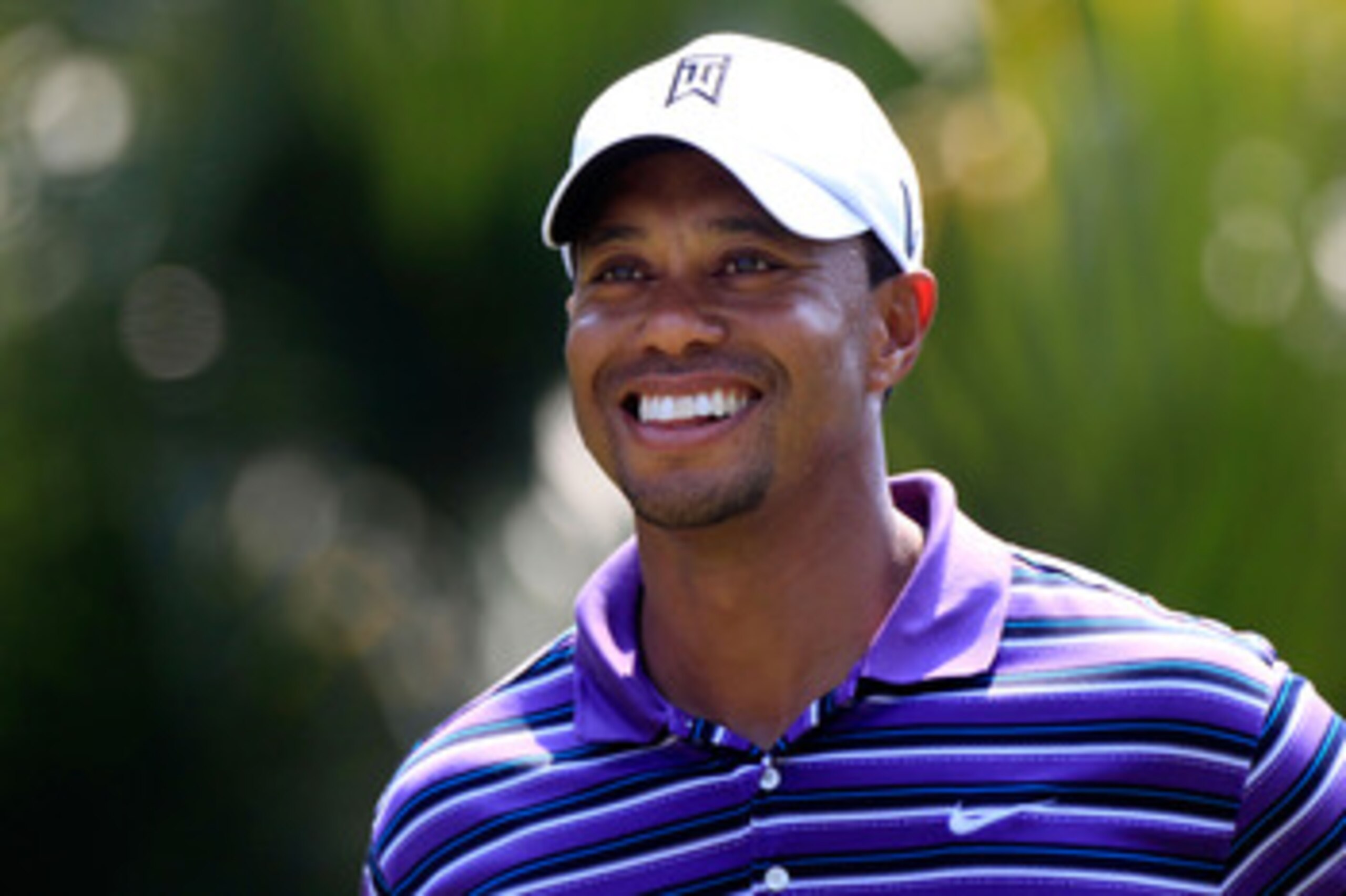 PONTE VEDRA BEACH, FL - MAY 10: Tiger Woods smiles as he looks on during a practice round prior to the start of THE PLAYERS Championship held at THE PLAYERS Stadium course at TPC Sawgrass on May 10, 2011 in Ponte Vedra Beach, Florida. (Photo by Sam Gree PONTE VEDRA BEACH, FL - MAY 10: Tiger Woods smiles as he looks on during a practice round prior to the start of THE PLAYERS Championship held at THE PLAYERS Stadium course at TPC Sawgrass on May 10, 2011 in Ponte Vedra Beach, Florida. (Photo by Sam Gree