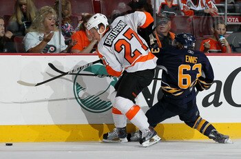 PHILADELPHIA - OCTOBER 01:  Erik Gustafsson #27 of the Philadelphia Flyers steals the puck from Tyler Ennis #63 of the Buffalo Sabres on October 1, 2010 at Wells Fargo Center in Philadelphia, Pennsylvania. The Flyers defeated the Sabres 3-1.  (Photo by Ji