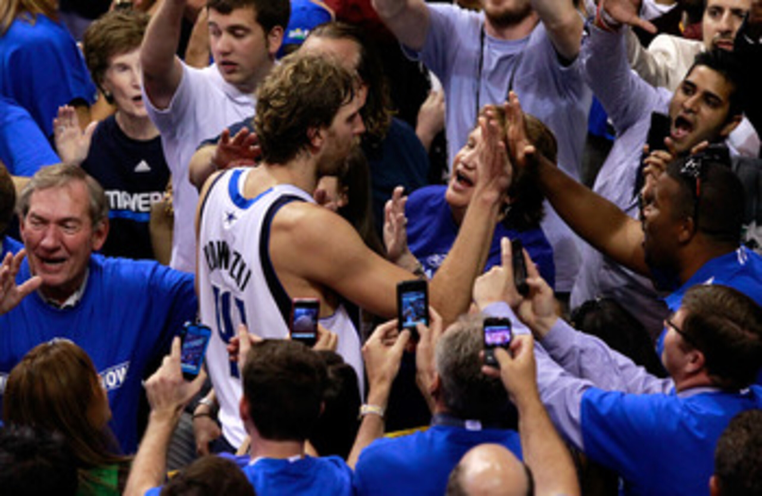 DALLAS, TX - JUNE 09:  Dirk Nowitzki #41 of the Dallas Mavericks celebrates with fans after the won 112-103 against the Miami Heat in Game Five of the 2011 NBA Finals at American Airlines Center on June 9, 2011 in Dallas, Texas.  NOTE TO USER: User expres