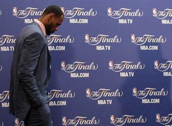 MIAMI, FL - JUNE 12:  LeBron James #6 of the Miami Heat walks into the interview room to answer questions after the Heat were defeated 105-95 by the Dallas Mavericks in Game Six of the 2011 NBA Finals at American Airlines Arena on June 12, 2011 in Miami,
