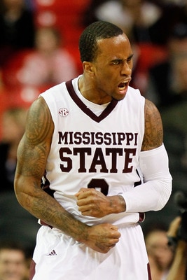 ATLANTA, GA - MARCH 11:  Dee Bost #3 of the Mississippi State Bulldogs celebrates after hitting a three pointer against the Vanderbilt Commodores during the quarterfinals of the SEC Men's Basketball Tournament at Georgia Dome on March 11, 2011 in Atlanta,