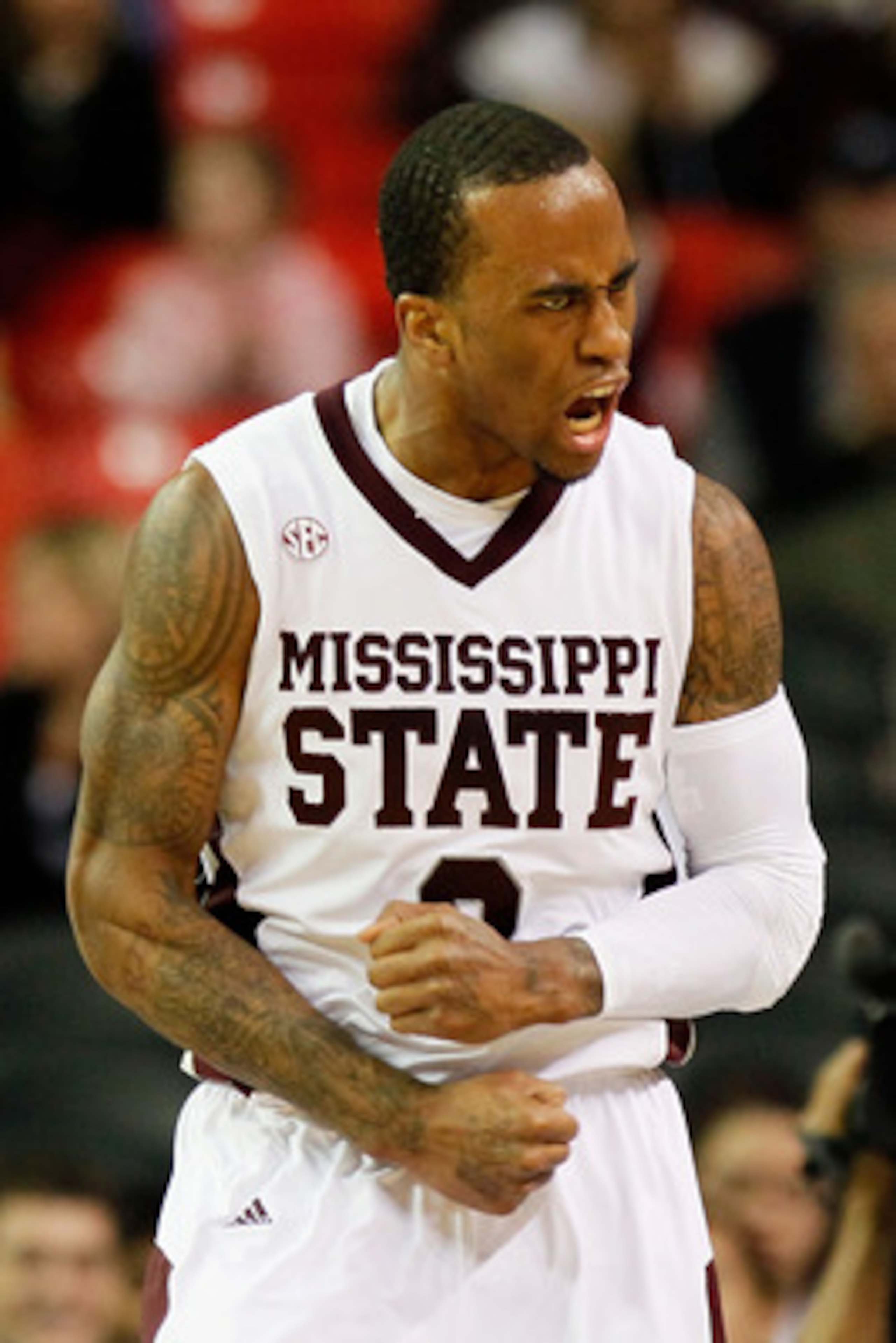 ATLANTA, GA - MARCH 11:  Dee Bost #3 of the Mississippi State Bulldogs celebrates after hitting a three pointer against the Vanderbilt Commodores during the quarterfinals of the SEC Men's Basketball Tournament at Georgia Dome on March 11, 2011 in Atlanta,