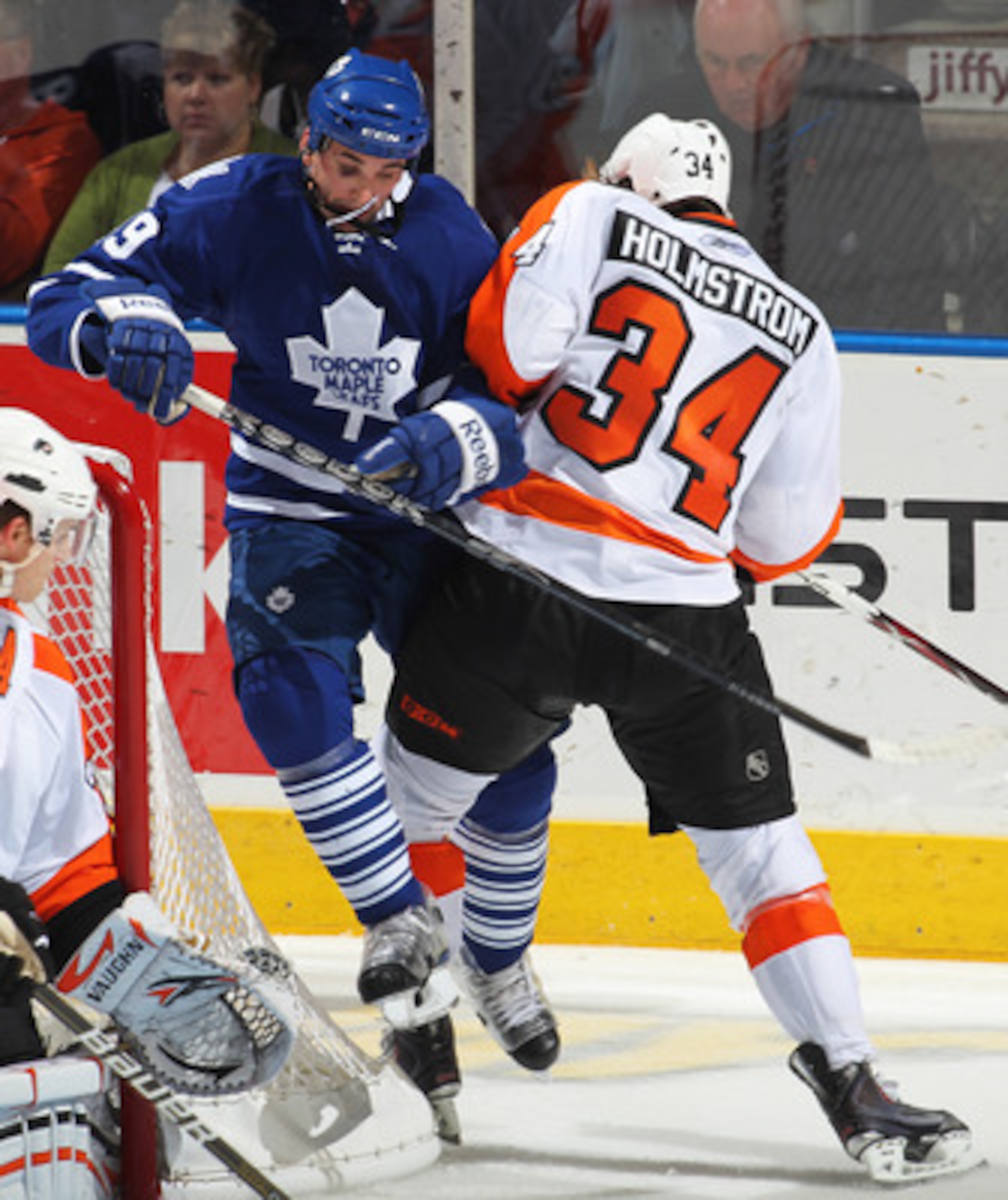 LONDON, CANADA - SEPTEMBER 23: Danny Richmond #49 of the Toronto Maple Leafs takes a big hit from Ben Holmstrom #34 of the Philadelphia Flyers in a preseason game on September 23,2010 at the John Labatt Centre in London, Ontario. The Leafs defeated the F LONDON, CANADA - SEPTEMBER 23: Danny Richmond #49 of the Toronto Maple Leafs takes a big hit from Ben Holmstrom #34 of the Philadelphia Flyers in a preseason game on September 23,2010 at the John Labatt Centre in London, Ontario. The Leafs defeated the F