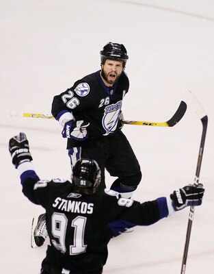 TAMPA, FL - MAY 25:  Martin St. Louis #26 celebrates his second period goal with Steven Stamkos #91 of the Tampa Bay Lightning in Game Six of the Eastern Conference Finals against the Boston Bruins during the 2011 NHL Stanley Cup Playoffs at St Pete Times