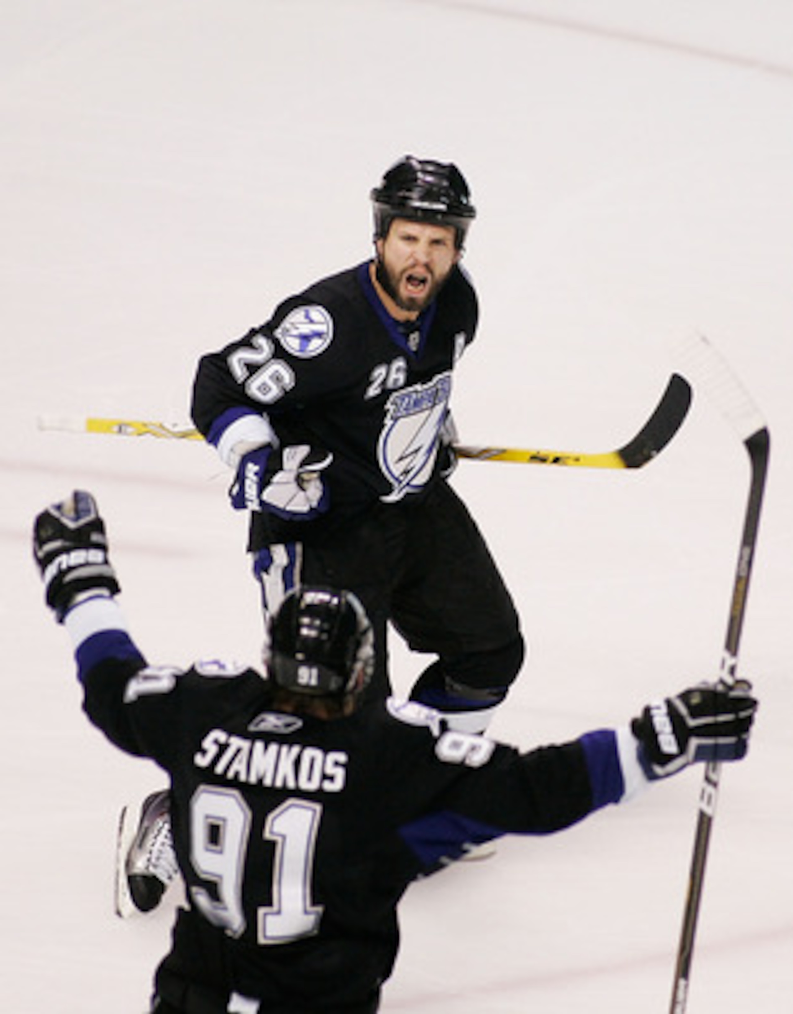 TAMPA, FL - MAY 25: Martin St. Louis #26 celebrates his second period goal with Steven Stamkos #91 of the Tampa Bay Lightning in Game Six of the Eastern Conference Finals against the Boston Bruins during the 2011 NHL Stanley Cup Playoffs at St Pete Times TAMPA, FL - MAY 25: Martin St. Louis #26 celebrates his second period goal with Steven Stamkos #91 of the Tampa Bay Lightning in Game Six of the Eastern Conference Finals against the Boston Bruins during the 2011 NHL Stanley Cup Playoffs at St Pete Times