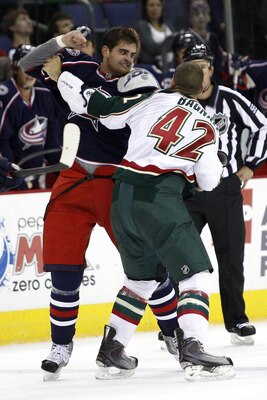 COLUMBUS,OH - SEPTEMBER 28:  Tom Sestito #23 of the Columbus Blue Jackets fights with Drew Bagnall #42 of the Minnesota Wild during the first period on September 28, 2010 at Nationwide Arena in Columbus, Ohio.  (Photo by John Grieshop/Getty Images)
