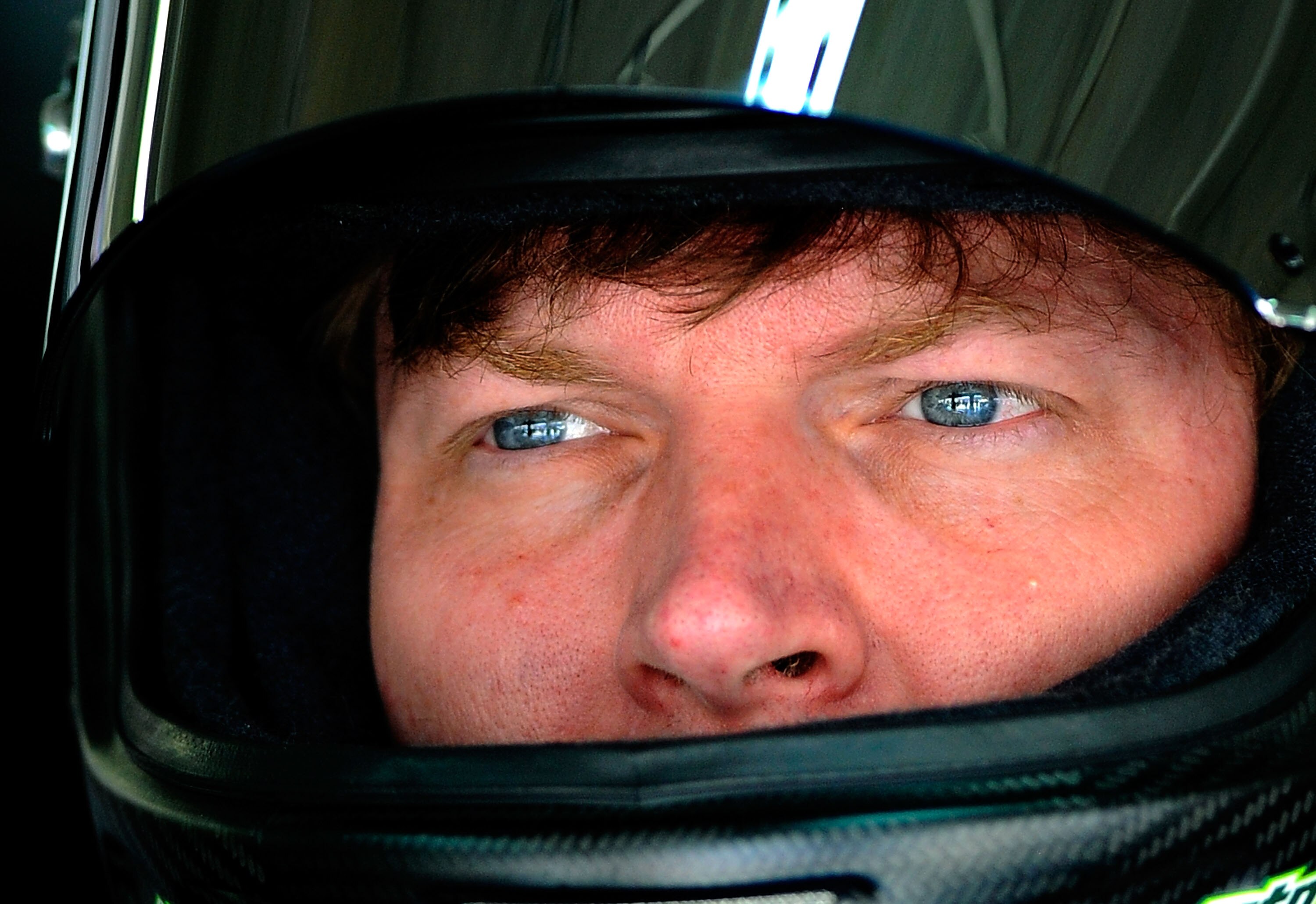 CHARLOTTE, NC - MAY 28:  Dale Earnhardt Jr., driver of the #88 National Guard/Amp Energy Chevrolet, stands in the garage during practice for the NASCAR Sprint Cup Series Coca-Cola 600 at Charlotte Motor Speedway on May 28, 2011 in Charlotte, North Carolin