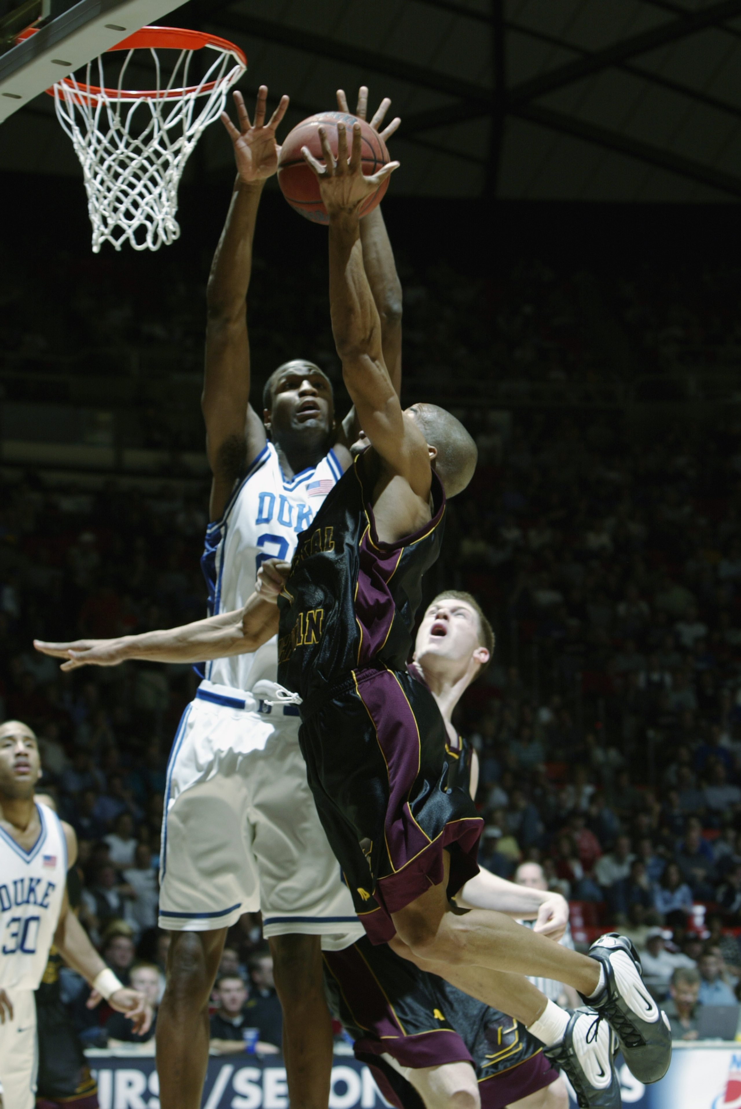 SALT LAKE CITY - MARCH 22:  Casey Sanders #20 of Duke goes up to block a shot by Central Michigan during the second round of the NCAA Tournament on March 22, 2003 at the Huntsman Center in Salt Lake City, Utah. Duke won 86-60.  (Photo by Jeff Gross/Getty