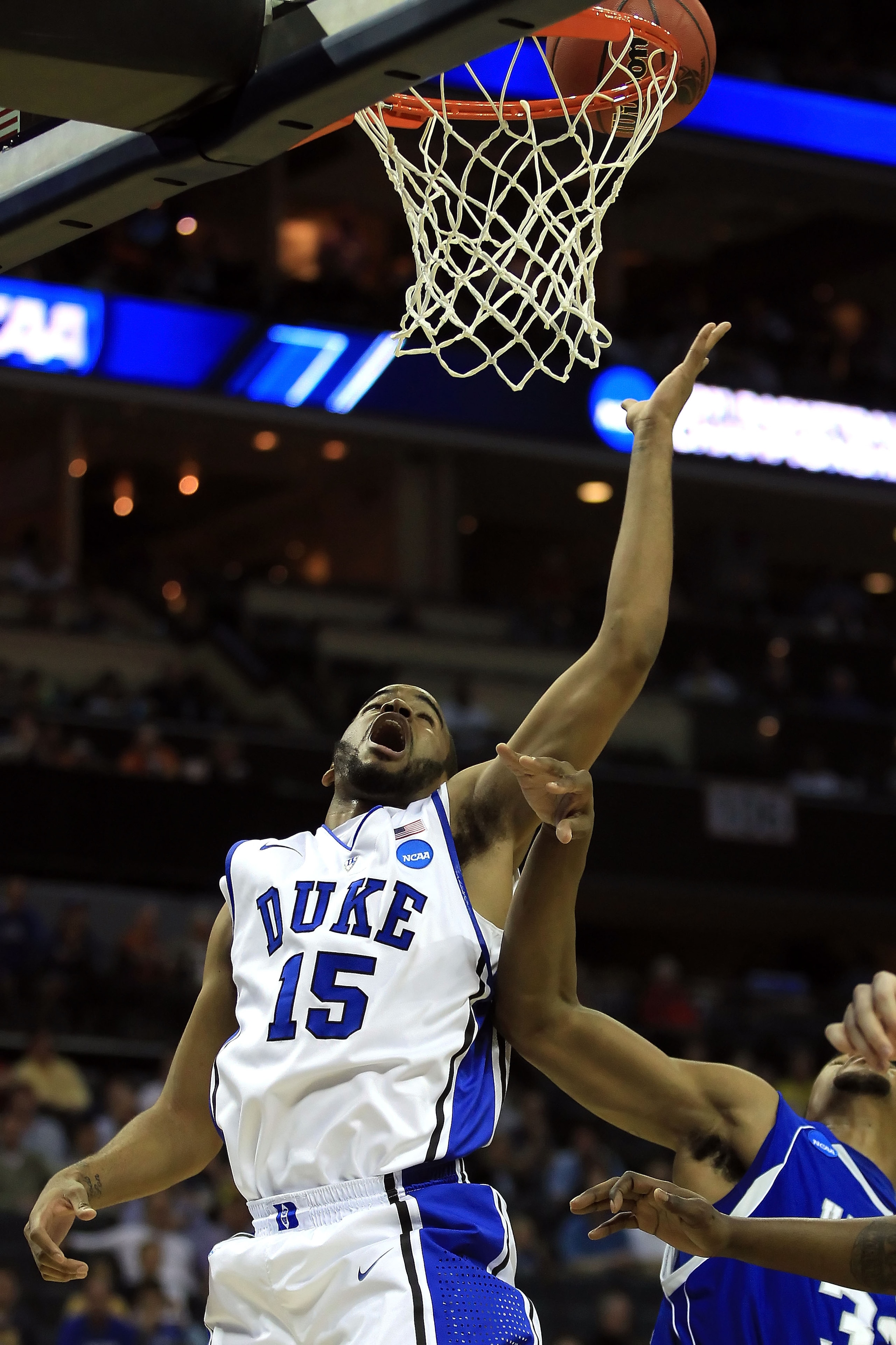 CHARLOTTE, NC - MARCH 18:  Josh Hairston #15 of the Duke Blue Devils lays the ball up against the Hampton Pirates during the second round of the 2011 NCAA men's basketball tournament at Time Warner Cable Arena on March 18, 2011 in Charlotte, North Carolin