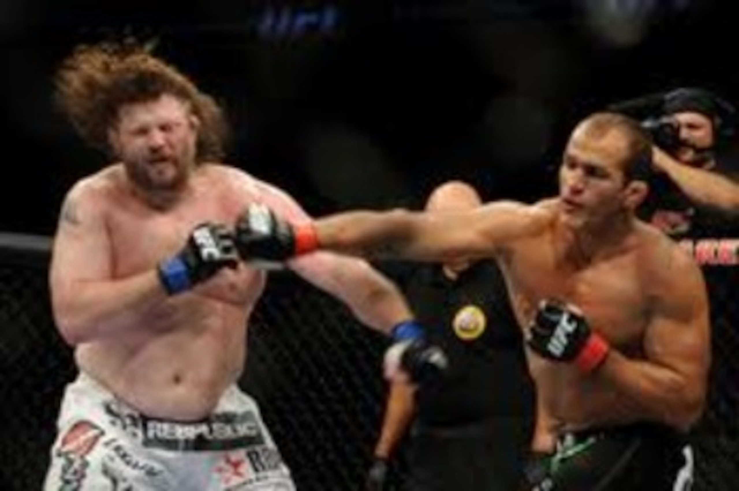 Junior dos Santos lands a solid right hand on the chin of Roy Nelson