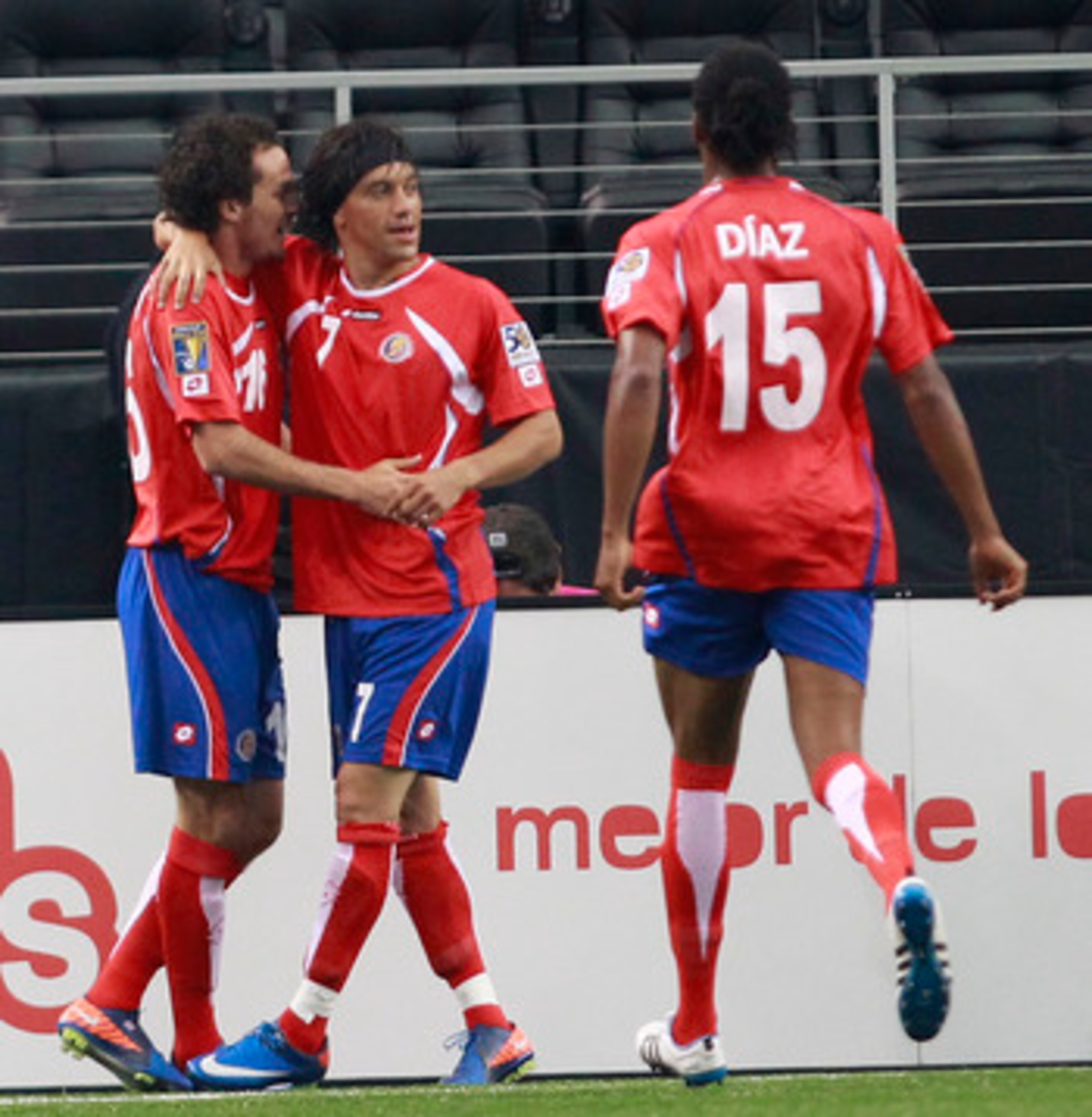 ARLINGTON, TX - JUNE 05:  Bolanos Christian #7 celebrates a goal with Urena Marco #16 and Diaz Junior #15 of Costa against Cuba during the CONCACAF Gold Cup qualifying match at Cowboys Stadium on June 5, 2011 in Arlington, Texas.  (Photo by Rick Yeatts/Ge