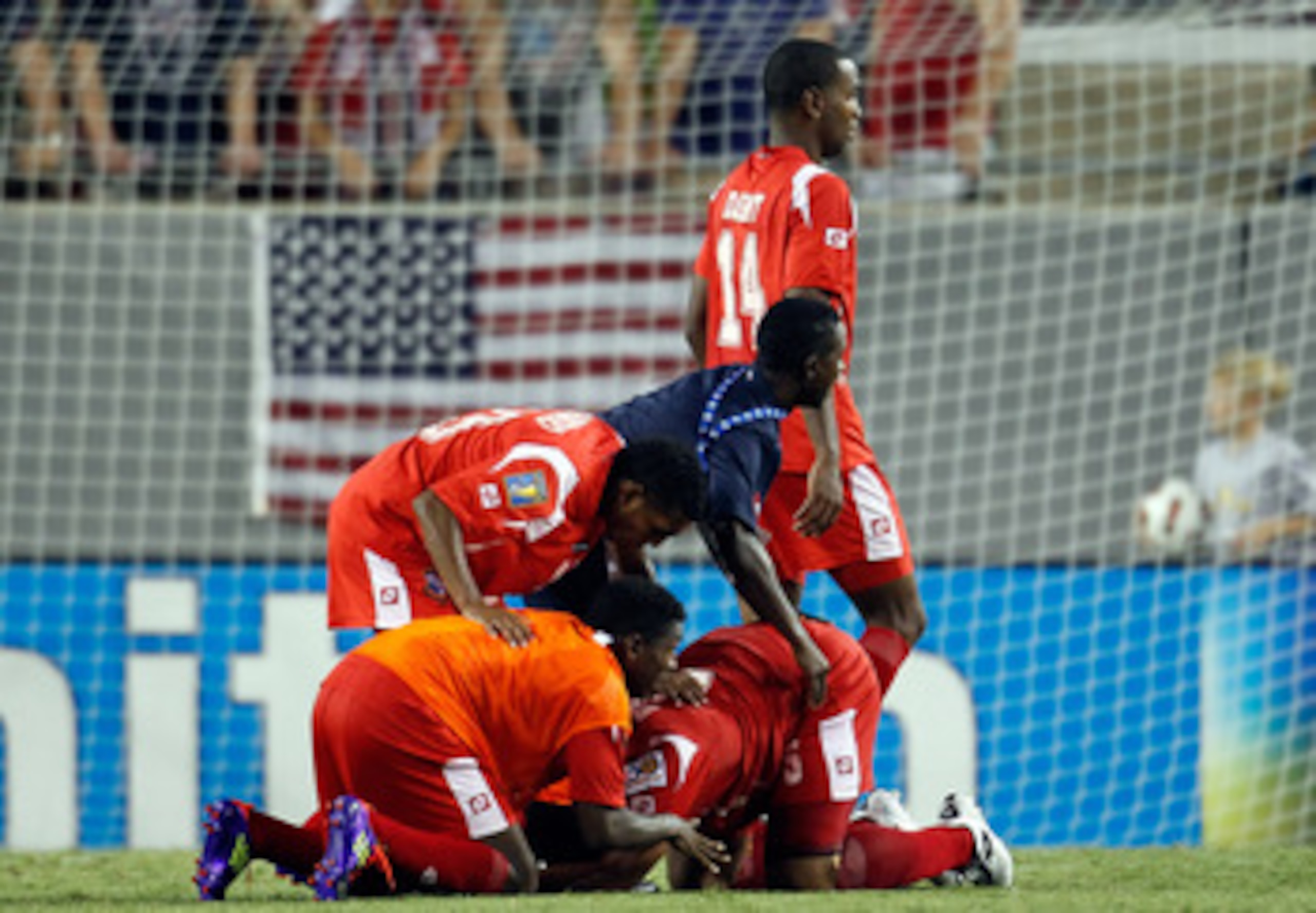 KANSAS CITY, KS - JUNE 14:  Blas Perez #7 of Panama is swarmed by teammates after scoring during the GoldCup game against Canada on June 14, 2011 at LiveStrong Sporting Park in Kansas City, Missouri.  (Photo by Jamie Squire/Getty Images)