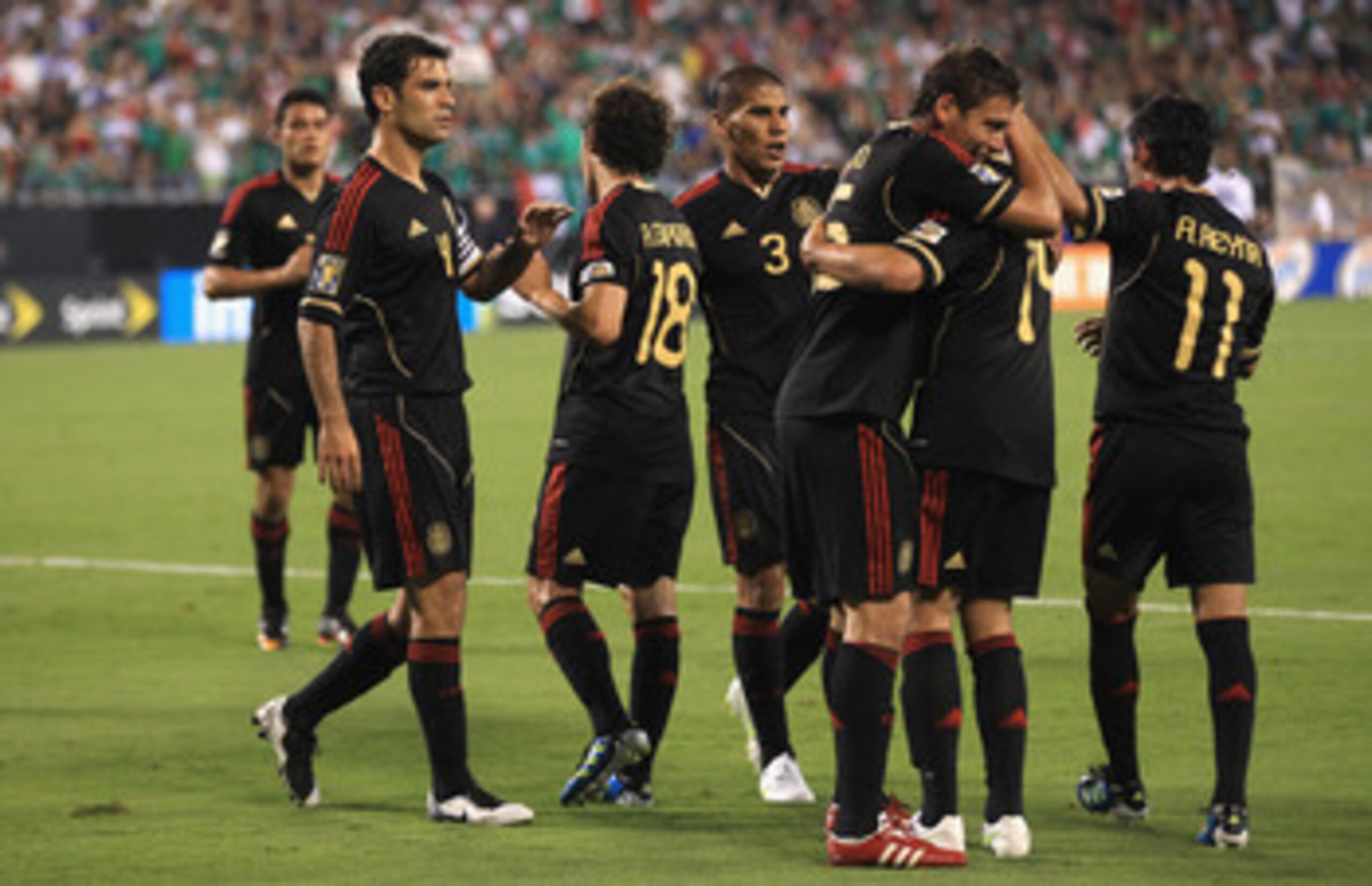 CHARLOTTE, NC - JUNE 09:  Hector Moreno #15 celebrates with teammate Javier Hernandez #13 of Mexico after a goal during their game in the CONCACAF Gold Cup at Bank of America Stadium on June 9, 2011 in Charlotte, North Carolina.  (Photo by Streeter Lecka/