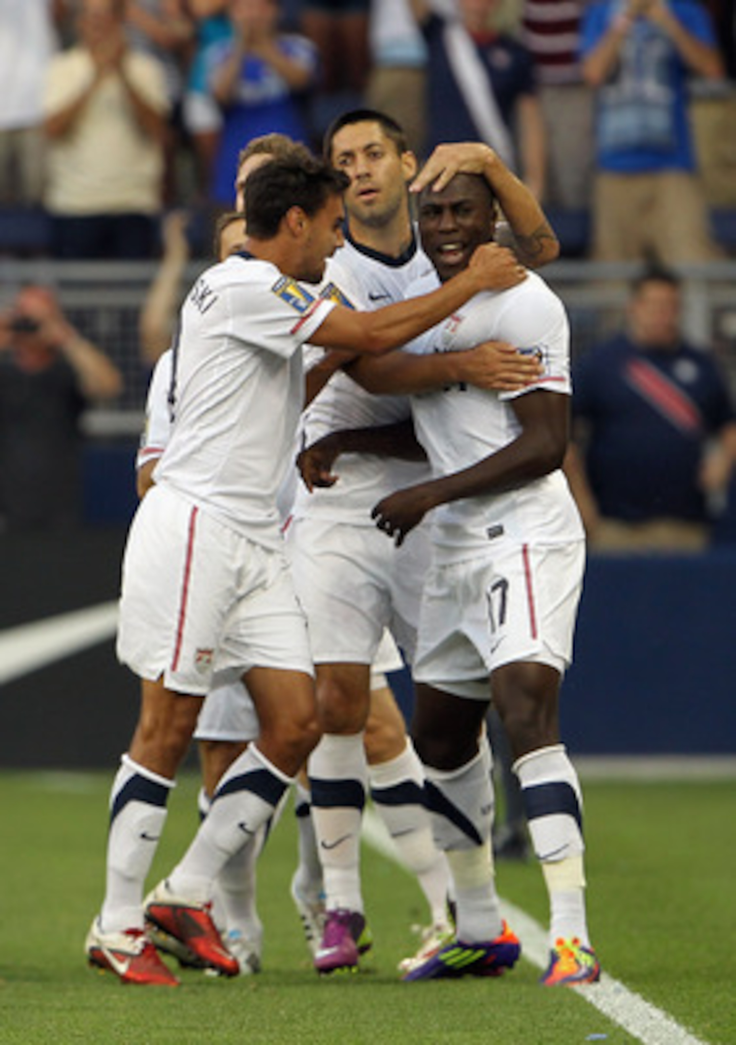 KANSAS CITY, MO - JUNE 14:  Jozy Altidore #17 of the USA is congratulated by teammates after scoring a goal during the first half of the GoldCup game against Guadeloupe on June 14, 2011 at LiveStrong Sporting Park in Kansas City, Kansas.  (Photo by Jamie 