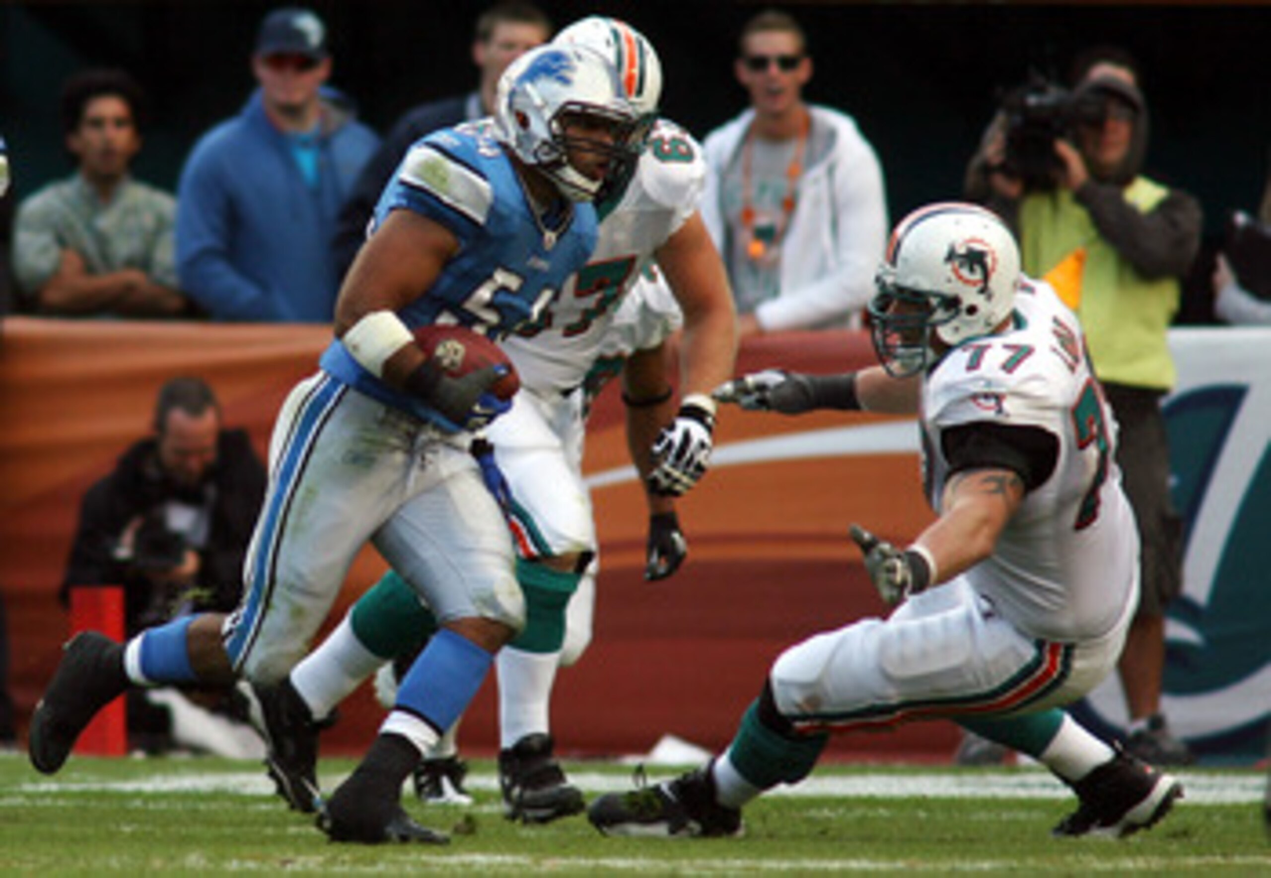 MIAMI - DECEMBER 26:  Linebacker DeAndre Levy #54 of the Detroit Lions runs in the game winning interception against the Miami Dolphins at Sun Life Stadium on December 26, 2010 in Miami, Florida. The Lions defeated the Dolphins 34-27.  (Photo by Marc Sero