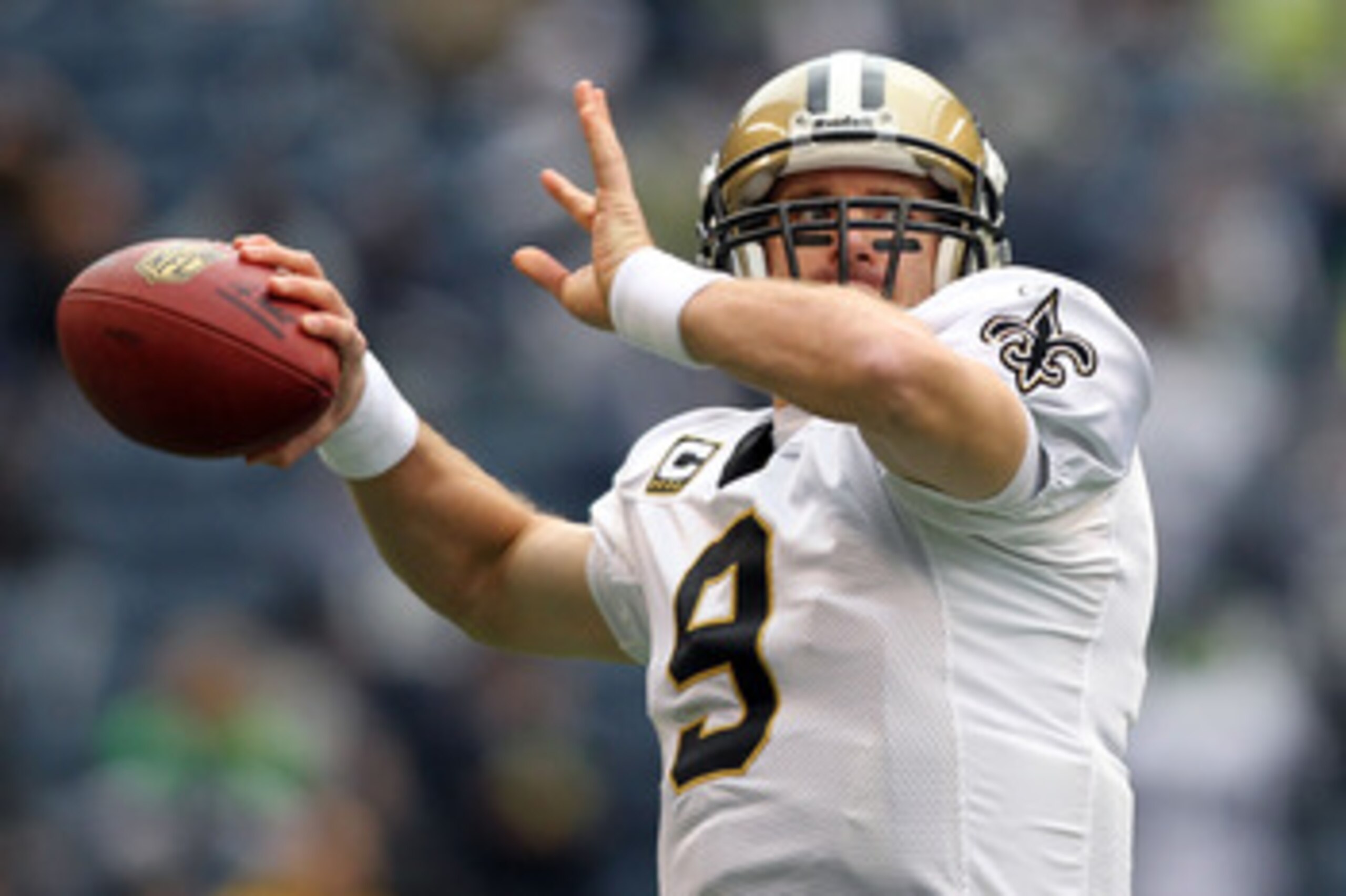 SEATTLE, WA - JANUARY 08:  Quarterback Drew Brees #9 of the New Orleans Saints warms-up before taking on the Seattle Seahawks during the 2011 NFC wild-card playoff game at Qwest Field on January 8, 2011 in Seattle, Washington.  (Photo by Jonathan Ferrey/G