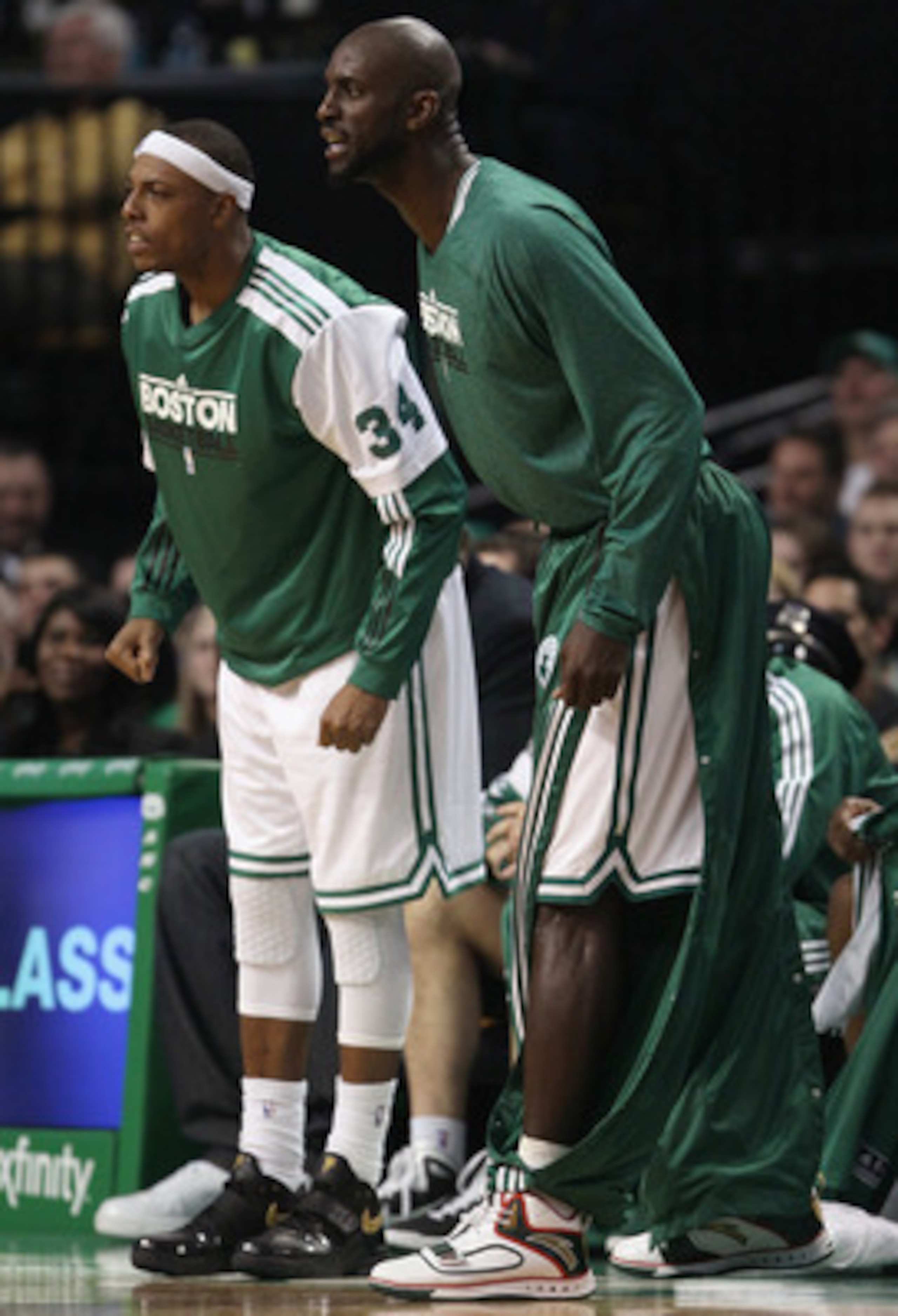 BOSTON, MA - JANUARY 25:  Paul Pierce #34 and Kevin Garnett #5 of the Boston Celitcs cheer on their teammates in the second half against the Cleveland Cavaliers on January 25, 2011 at the TD Garden in Boston, Massachusetts. The Celtics defeated the Cavali