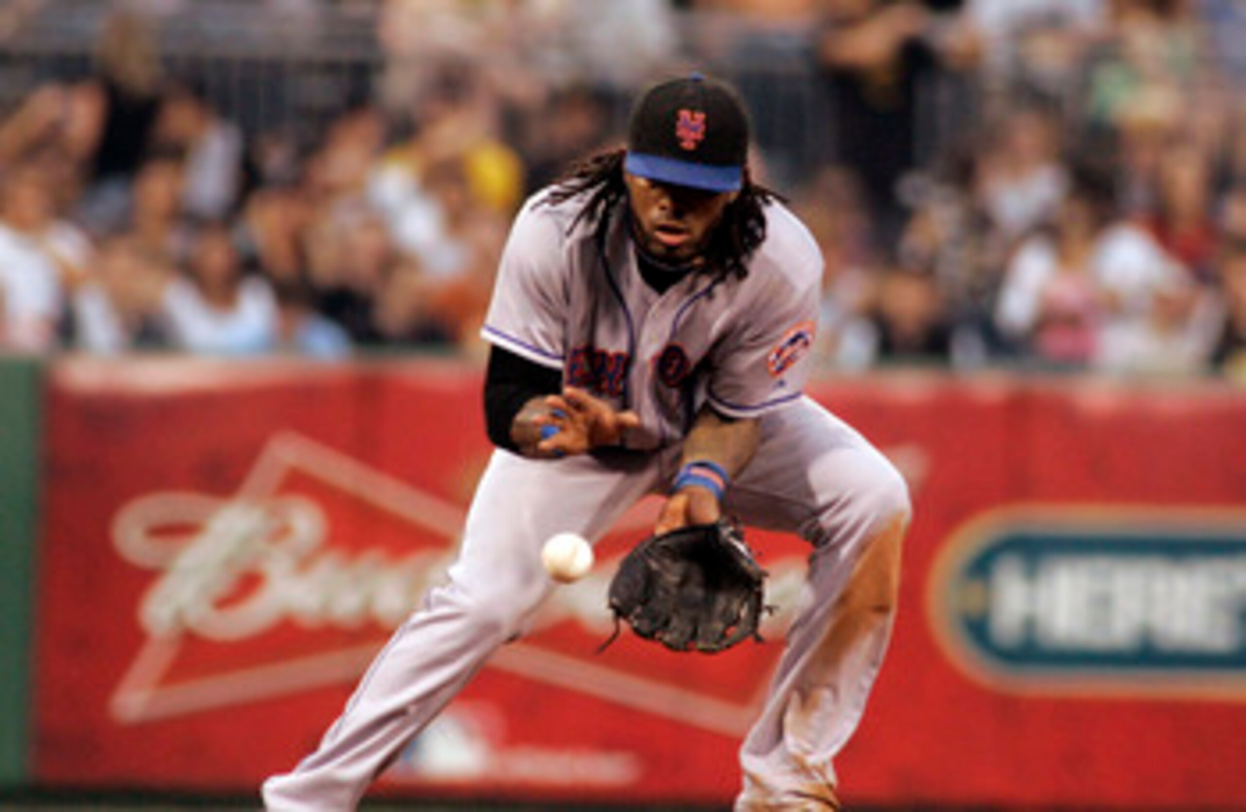PITTSBURGH, PA - JUNE 10:  Jose Reyes #7 of the New York Mets fields a ground ball against the Pittsburgh Pirates during the game on June 10, 2011 at PNC Park in Pittsburgh, Pennsylvania.  (Photo by Justin K. Aller/Getty Images)