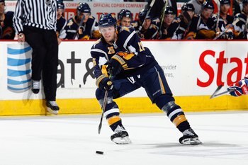 BUFFALO - OCTOBER 10:  Tomas Vanek #26 of the Buffalo Sabres passes the puck during the game against the Montreal Canadiens at HSBC Arena on October 10, 2008 in Buffalo, New York. (Photo by: Rick Stewart/Getty Images)