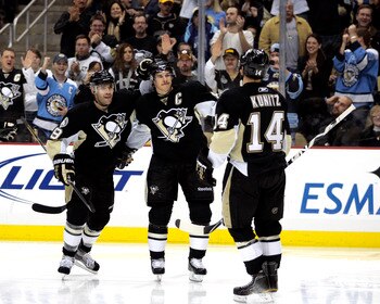 PITTSBURGH, PA - DECEMBER 28:  Chris Kunitz #14 of the Pittsburgh Penguins celebrates his third period goal with teammates Sidney Crosby #87 and Pascal Dupuis #9 against the Atlanta Thrashers at Consol Energy Center on December 28, 2010 in Pittsburgh, Pen