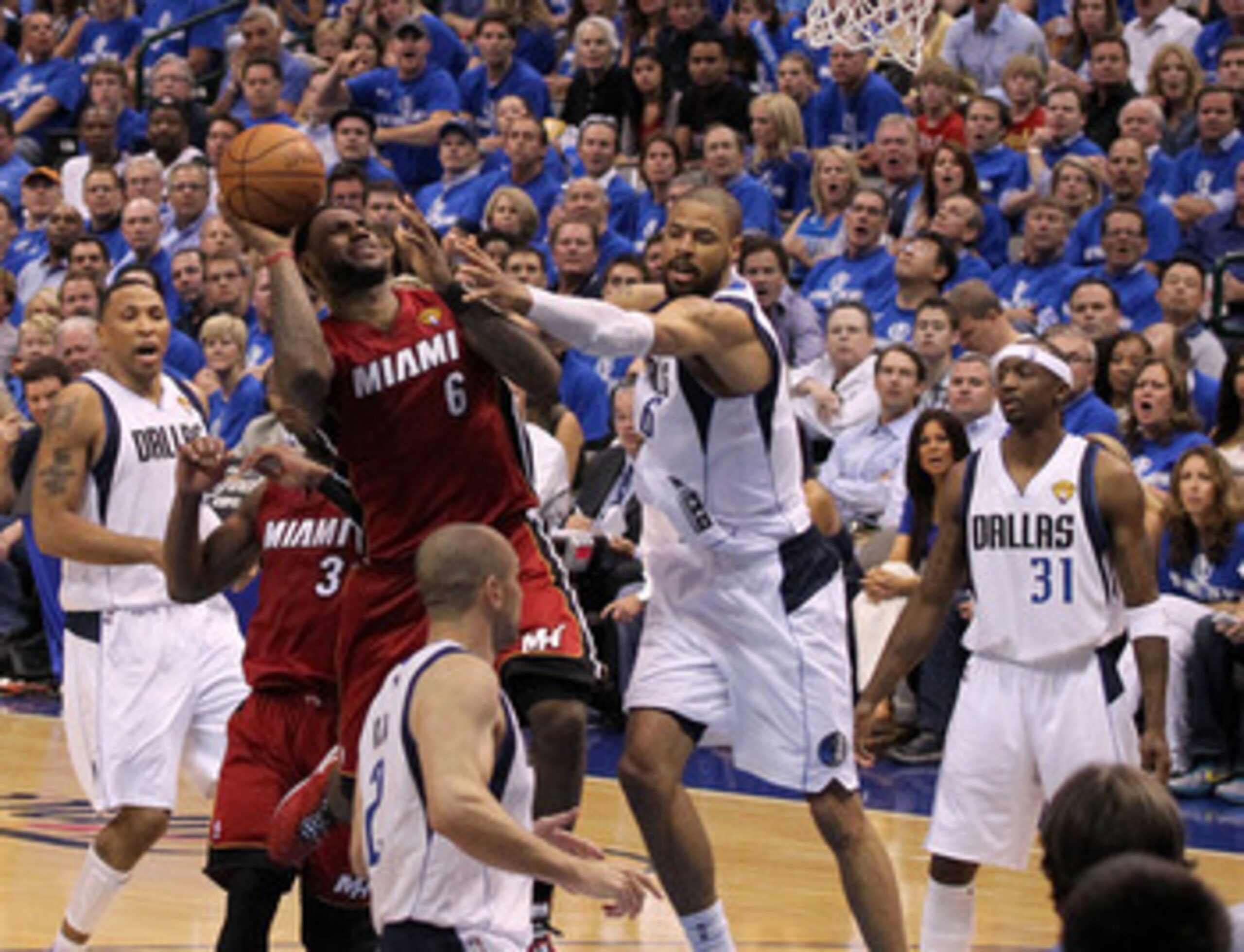 DALLAS, TX - JUNE 07:  LeBron James #6 of the Miami Heat attempts a shot against Tyson Chandler #6 of the Dallas Mavericks in Game Four of the 2011 NBA Finals at American Airlines Center on June 7, 2011 in Dallas, Texas. NOTE TO USER: User expressly ackno
